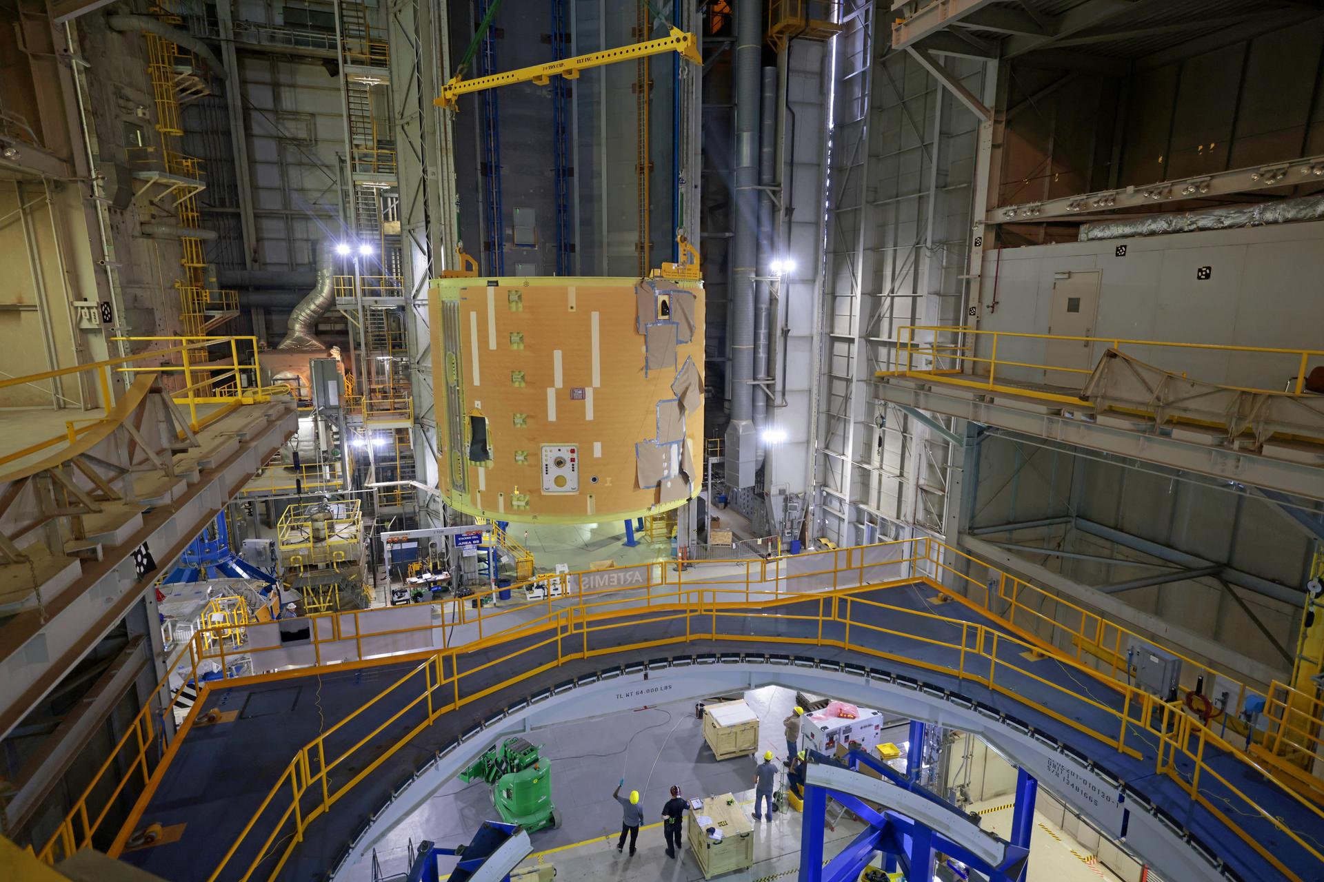 Teams at NASA’s Michoud Assembly Facility in New Orleans move the 21.8-foot-tall intertank for the core stage of the agency’s Artemis III mission into the vertical assembly building on Oct. 21. Inside the production cell, NASA’s prime contractor for the SLS (Space Launch System) core stage, Boeing, will mate the intertank to the liquid oxygen tank and the forward skirt in a process called a “forward join.”   The intertank houses avionics and electronics, serves as an attachment point for the solid rocket boosters, and is one of five major elements that make up the 212-foot-tall rocket stage. The core stage, along with its four RS-25 engines, produce more than two million pounds of thrust to help launch NASA’s Orion spacecraft, astronauts, and supplies beyond Earth’s orbit and to the lunar surface for Artemis.    Image credit: NASA/Michael DeMocker