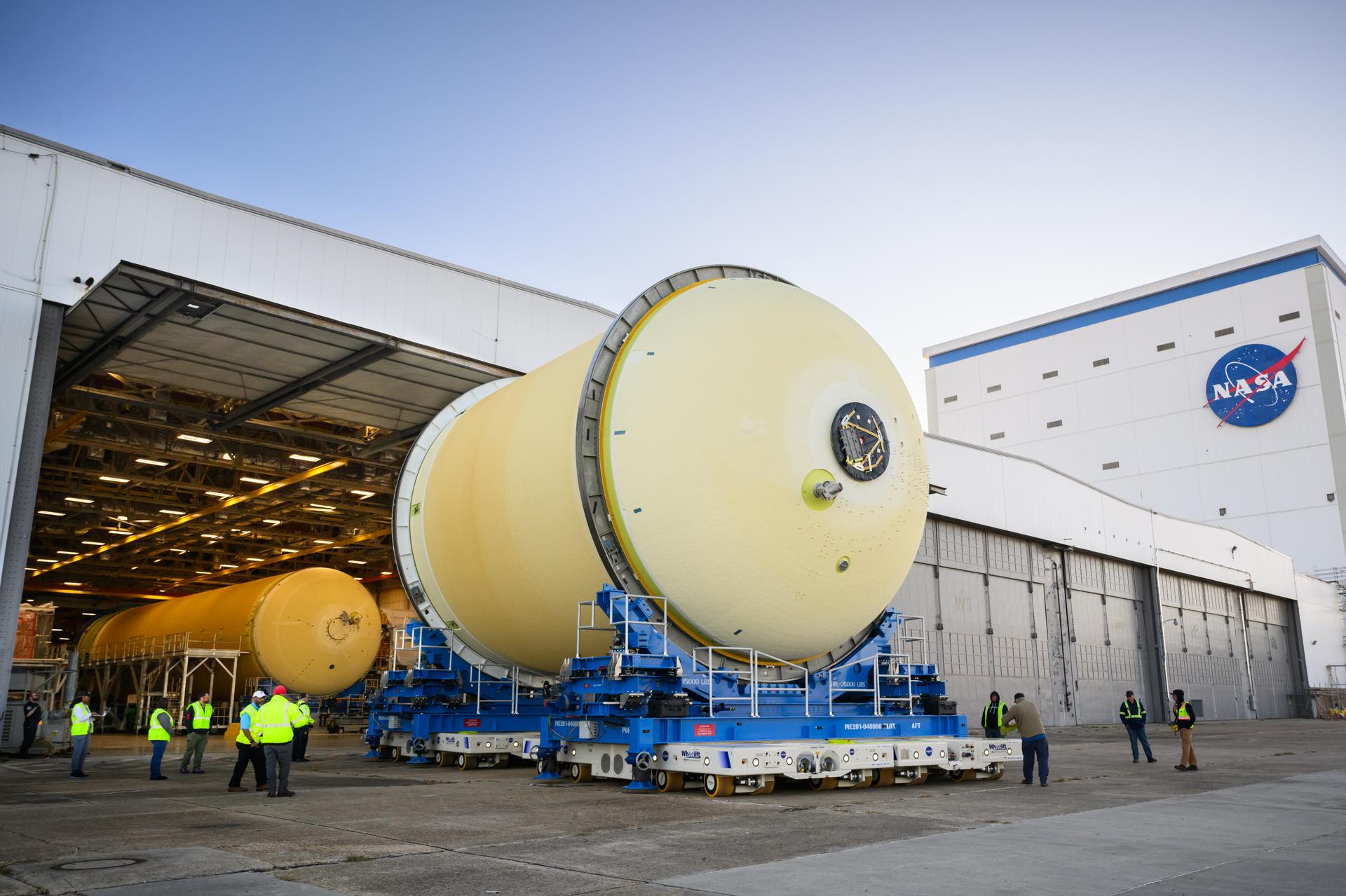 Move crews at NASA’s Michoud Assembly Facility in New Orleans move the liquid oxygen tank for the core stage of the agency’s Artemis III mission into the facility’s vertical assembly building on Nov.3. Eventually, teams with SLS (Space Launch System) prime contractor, Boeing, will lift the tank into the production cell currently housing the intertank and mate the flight hardware together before capping them off with the forward skirt to complete the core stage forward join.     The propellant tank is one of five major elements that make up the 212-foot-tall rocket stage. The core stage, along with its four RS-25 engines, produce more than two million pounds of thrust to help launch NASA’s Orion spacecraft, astronauts, and supplies beyond Earth’s orbit and to the lunar surface for Artemis.