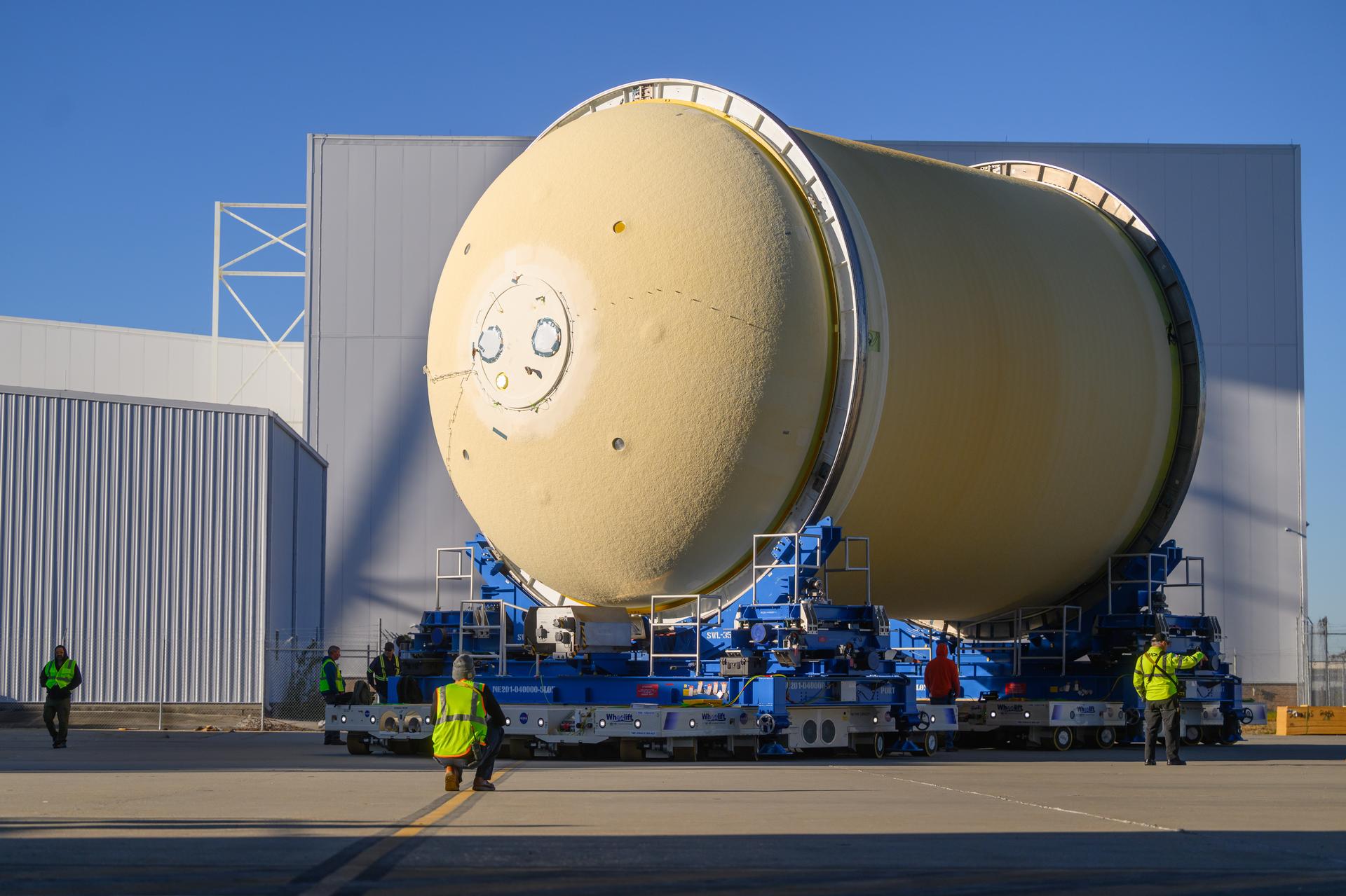 Move crews at NASA’s Michoud Assembly Facility in New Orleans move the liquid oxygen tank for the core stage of the agency’s Artemis III mission into the facility’s vertical assembly building on Nov.3. Eventually, teams with SLS (Space Launch System) prime contractor, Boeing, will lift the tank into the production cell currently housing the intertank and mate the flight hardware together before capping them off with the forward skirt to complete the core stage forward join.     The propellant tank is one of five major elements that make up the 212-foot-tall rocket stage. The core stage, along with its four RS-25 engines, produce more than two million pounds of thrust to help launch NASA’s Orion spacecraft, astronauts, and supplies beyond Earth’s orbit and to the lunar surface for Artemis.