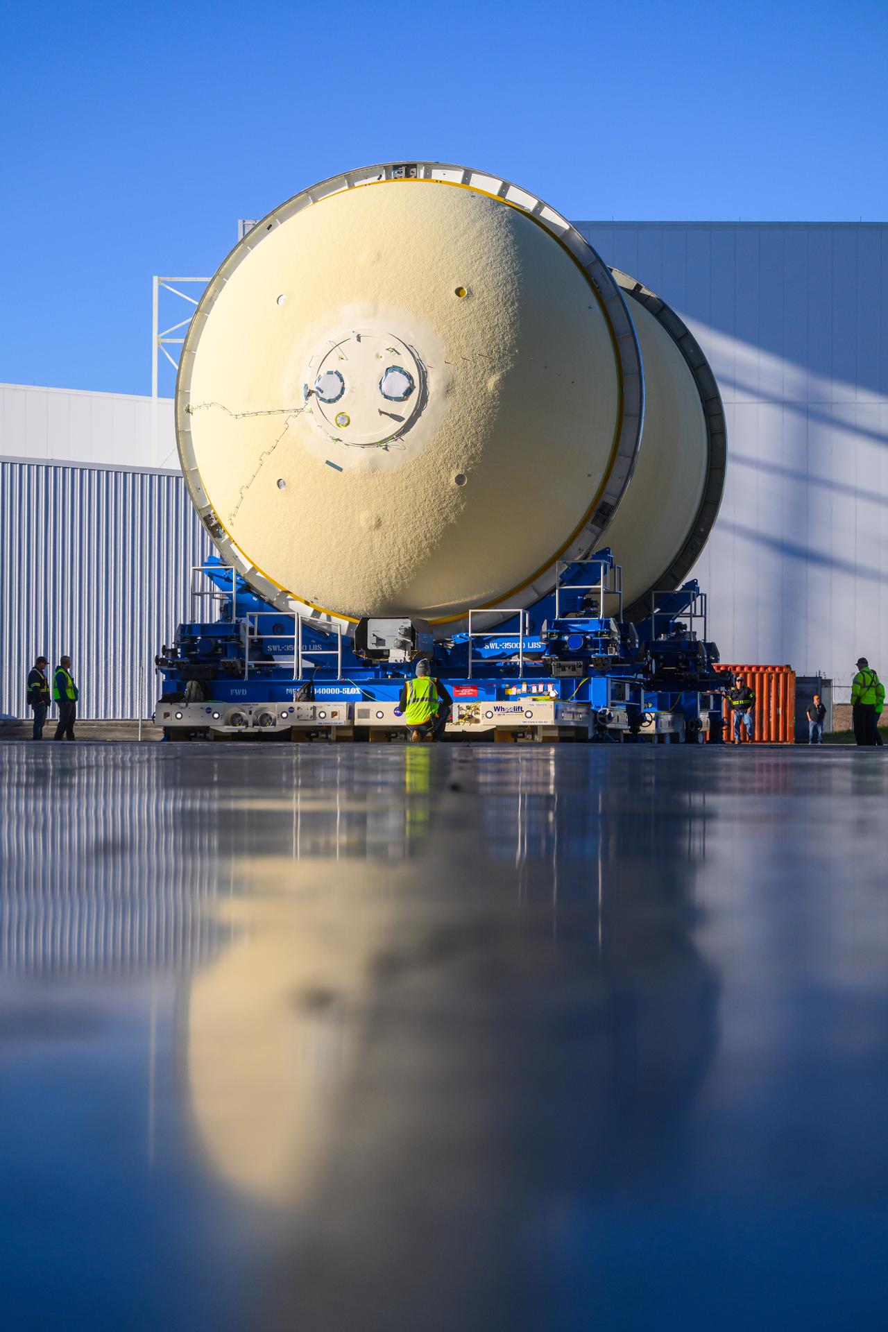 Move crews at NASA’s Michoud Assembly Facility in New Orleans move the liquid oxygen tank for the core stage of the agency’s Artemis III mission into the facility’s vertical assembly building on Nov.3. Eventually, teams with SLS (Space Launch System) prime contractor, Boeing, will lift the tank into the production cell currently housing the intertank and mate the flight hardware together before capping them off with the forward skirt to complete the core stage forward join.     The propellant tank is one of five major elements that make up the 212-foot-tall rocket stage. The core stage, along with its four RS-25 engines, produce more than two million pounds of thrust to help launch NASA’s Orion spacecraft, astronauts, and supplies beyond Earth’s orbit and to the lunar surface for Artemis.