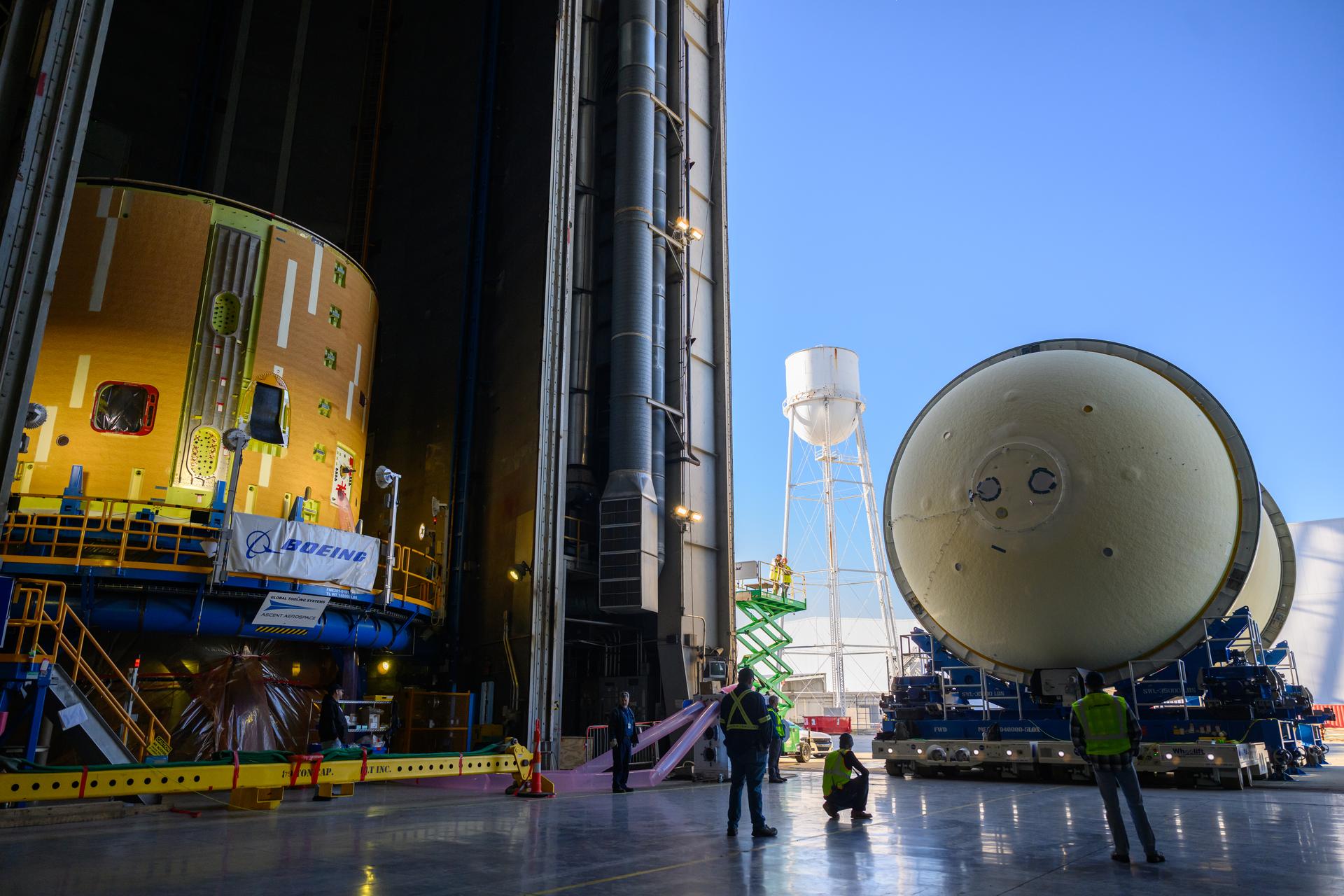 Move crews at NASA’s Michoud Assembly Facility in New Orleans move the liquid oxygen tank for the core stage of the agency’s Artemis III mission into the facility’s vertical assembly building on Nov.3. Eventually, teams with SLS (Space Launch System) prime contractor, Boeing, will lift the tank into the production cell currently housing the intertank and mate the flight hardware together before capping them off with the forward skirt to complete the core stage forward join.     The propellant tank is one of five major elements that make up the 212-foot-tall rocket stage. The core stage, along with its four RS-25 engines, produce more than two million pounds of thrust to help launch NASA’s Orion spacecraft, astronauts, and supplies beyond Earth’s orbit and to the lunar surface for Artemis.