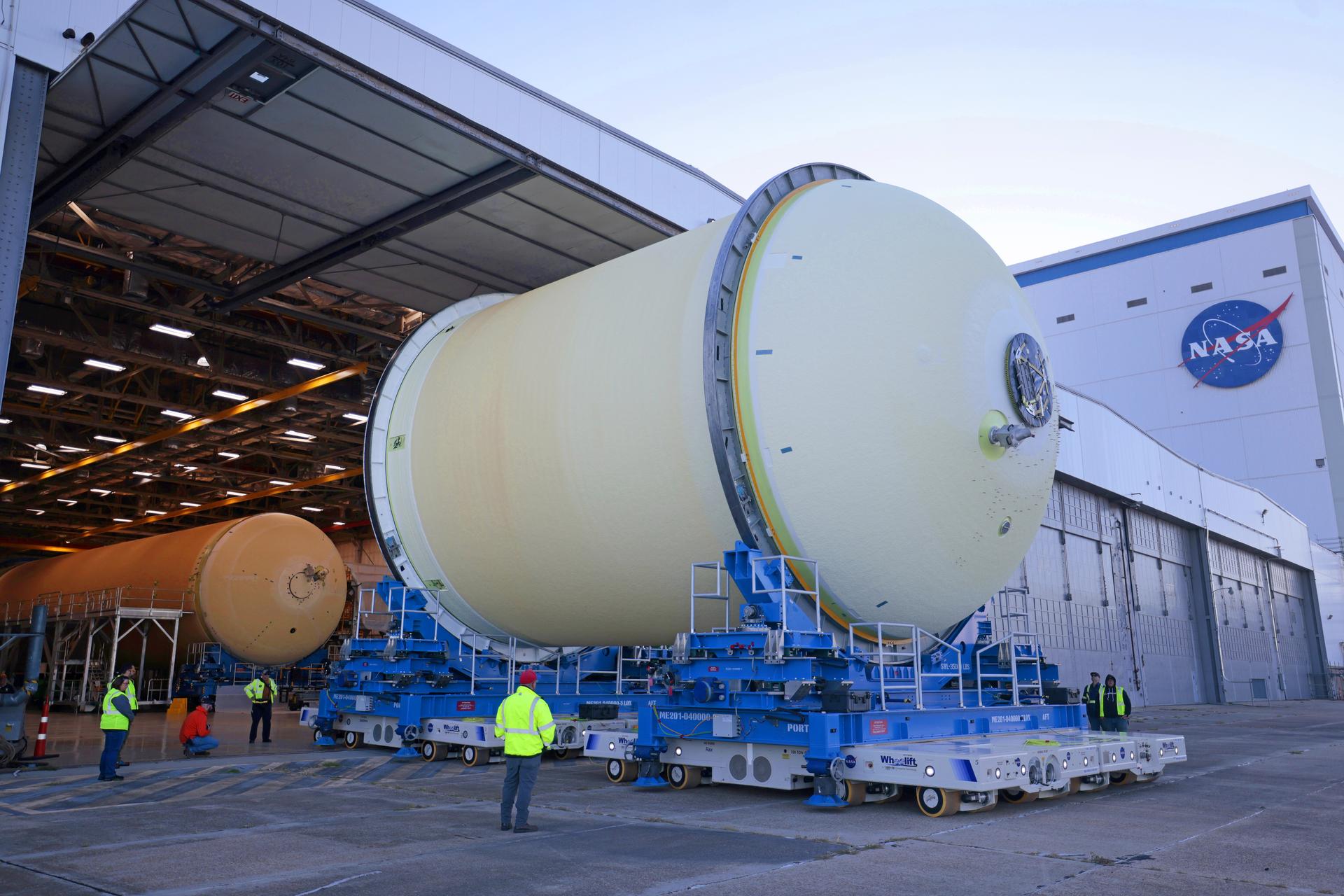 Move crews at NASA’s Michoud Assembly Facility in New Orleans move the liquid oxygen tank for the core stage of the agency’s Artemis III mission into the facility’s vertical assembly building on Nov.3. Eventually, teams with SLS (Space Launch System) prime contractor, Boeing, will lift the tank into the production cell currently housing the intertank and mate the flight hardware together before capping them off with the forward skirt to complete the core stage forward join.   The propellant tank is one of five major elements that make up the 212-foot-tall rocket stage. The core stage, along with its four RS-25 engines, produce more than two million pounds of thrust to help launch NASA’s Orion spacecraft, astronauts, and supplies beyond Earth’s orbit and to the lunar surface for Artemis.   Image credit: NASA/Michael DeMocker