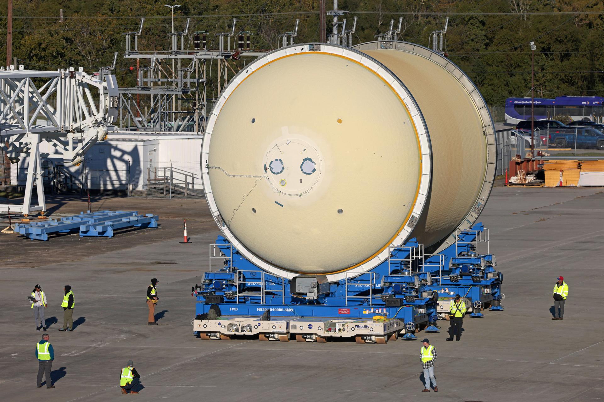 Move crews at NASA’s Michoud Assembly Facility in New Orleans move the liquid oxygen tank for the core stage of the agency’s Artemis III mission into the facility’s vertical assembly building on Nov.3. Eventually, teams with SLS (Space Launch System) prime contractor, Boeing, will lift the tank into the production cell currently housing the intertank and mate the flight hardware together before capping them off with the forward skirt to complete the core stage forward join.   The propellant tank is one of five major elements that make up the 212-foot-tall rocket stage. The core stage, along with its four RS-25 engines, produce more than two million pounds of thrust to help launch NASA’s Orion spacecraft, astronauts, and supplies beyond Earth’s orbit and to the lunar surface for Artemis.   Image credit: NASA/Michael DeMocker
