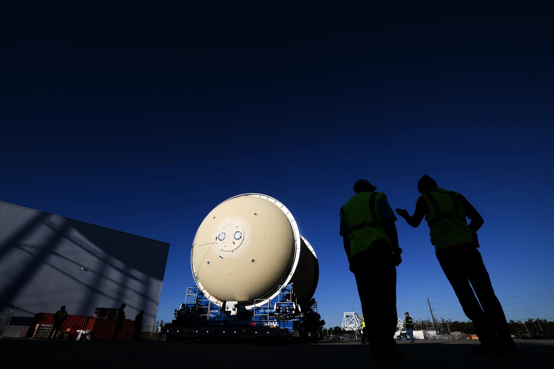 Move crews at NASA’s Michoud Assembly Facility in New Orleans move the liquid oxygen tank for the core stage of the agency’s Artemis III mission into the facility’s vertical assembly building on Nov.3. Eventually, teams with SLS (Space Launch System) prime contractor, Boeing, will lift the tank into the production cell currently housing the intertank and mate the flight hardware together before capping them off with the forward skirt to complete the core stage forward join.   The propellant tank is one of five major elements that make up the 212-foot-tall rocket stage. The core stage, along with its four RS-25 engines, produce more than two million pounds of thrust to help launch NASA’s Orion spacecraft, astronauts, and supplies beyond Earth’s orbit and to the lunar surface for Artemis.   Image credit: NASA/Michael DeMocker