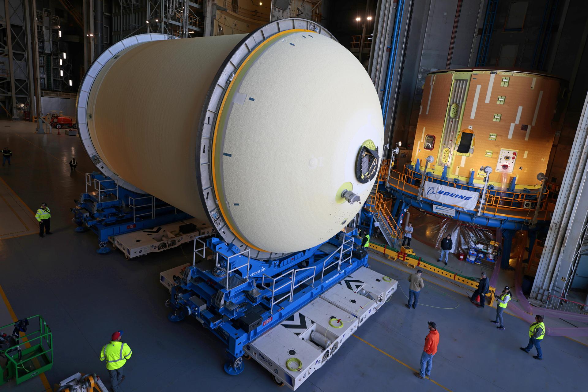 Move crews at NASA’s Michoud Assembly Facility in New Orleans move the liquid oxygen tank for the core stage of the agency’s Artemis III mission into the facility’s vertical assembly building on Nov.3. Eventually, teams with SLS (Space Launch System) prime contractor, Boeing, will lift the tank into the production cell currently housing the intertank and mate the flight hardware together before capping them off with the forward skirt to complete the core stage forward join.   The propellant tank is one of five major elements that make up the 212-foot-tall rocket stage. The core stage, along with its four RS-25 engines, produce more than two million pounds of thrust to help launch NASA’s Orion spacecraft, astronauts, and supplies beyond Earth’s orbit and to the lunar surface for Artemis.   Image credit: NASA/Michael DeMocker