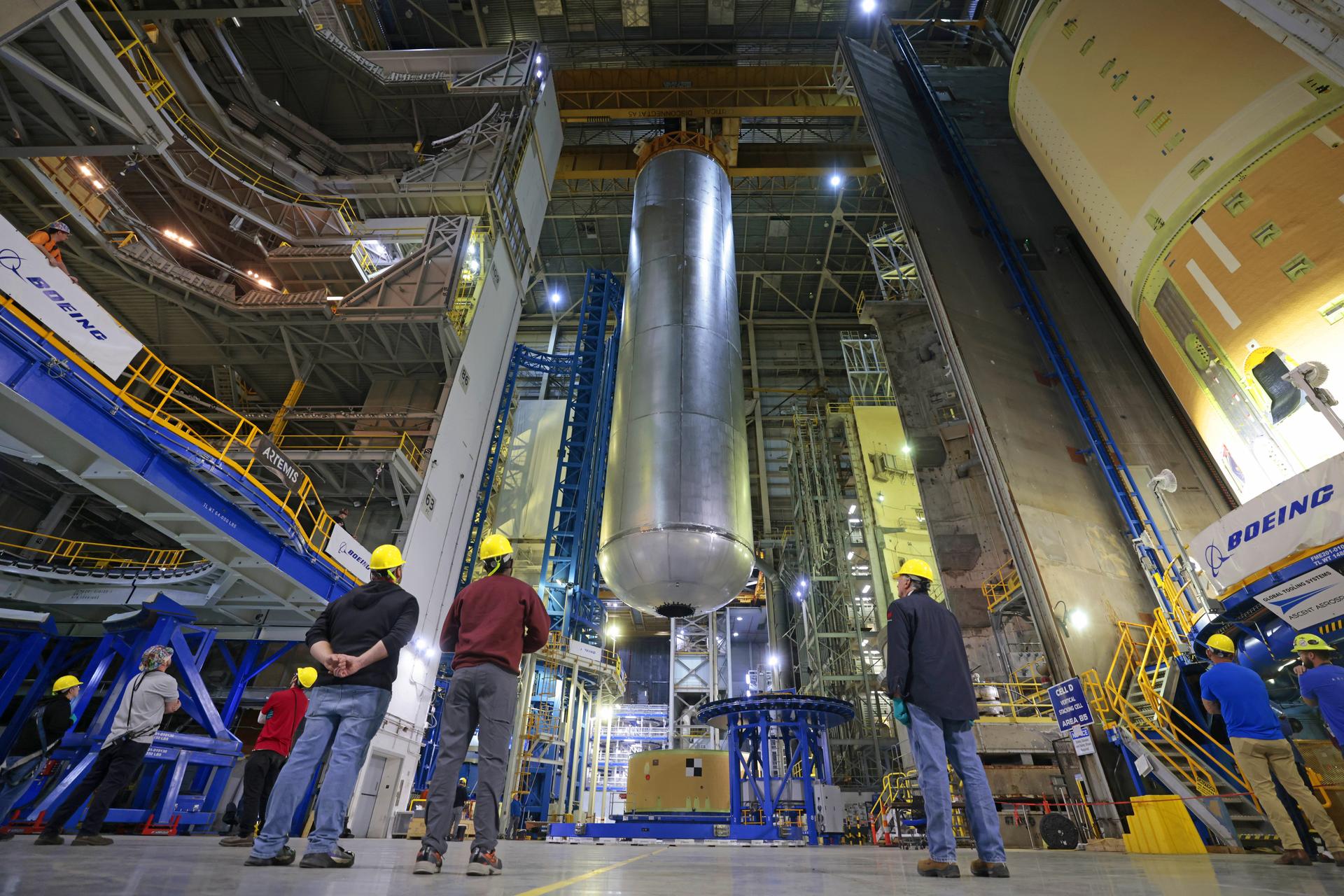 Teams at NASA’s Michoud Assembly Facility in New Orleans lift the 130-foot-tall liquid hydrogen tank off the vertical assembly center on Nov. 14. This is the fourth liquid hydrogen tank manufactured at the facility for the agency’s SLS (Space Launch System) rocket. The completed tank will be loaded into a production cell for technicians to remove the lift tool, perform dimensional scans, and then install brackets, which will allow the move crew to break the tank over from a vertical to a horizontal configuration.  The propellant tank is one of five major elements that make up the 212-foot-tall rocket stage. The core stage, along with its four RS-25 engines, produce more than two million pounds of thrust to help launch NASA’s Orion spacecraft, astronauts, and supplies beyond Earth’s orbit and to the lunar surface for Artemis.    Image credit: NASA/Michael DeMocker