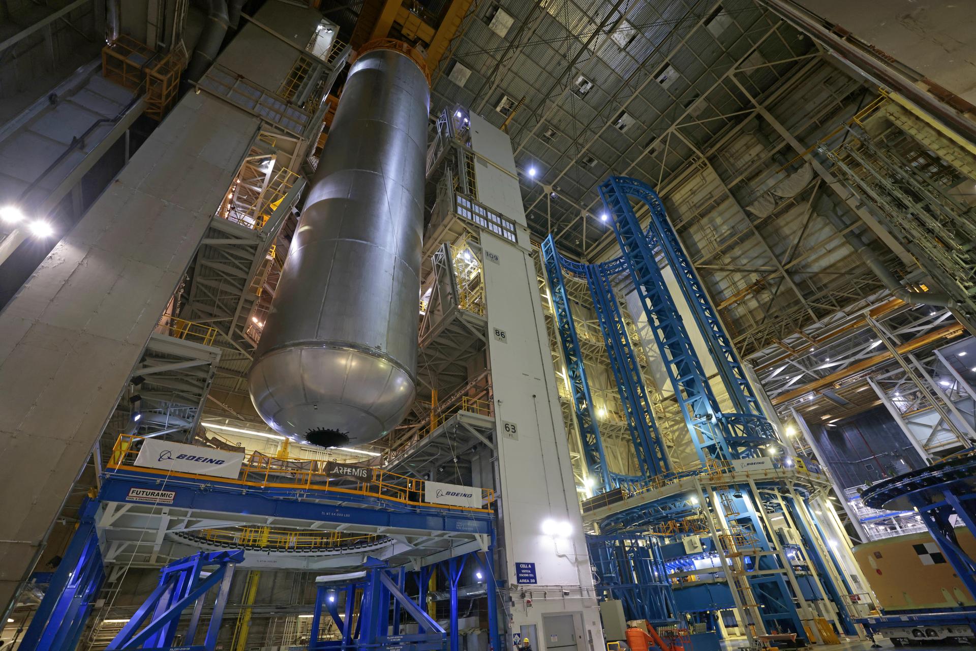 Teams at NASA’s Michoud Assembly Facility in New Orleans lift the 130-foot-tall liquid hydrogen tank off the vertical assembly center on Nov. 14. This is the fourth liquid hydrogen tank manufactured at the facility for the agency’s SLS (Space Launch System) rocket. The completed tank will be loaded into a production cell for technicians to remove the lift tool, perform dimensional scans, and then install brackets, which will allow the move crew to break the tank over from a vertical to a horizontal configuration.  The propellant tank is one of five major elements that make up the 212-foot-tall rocket stage. The core stage, along with its four RS-25 engines, produce more than two million pounds of thrust to help launch NASA’s Orion spacecraft, astronauts, and supplies beyond Earth’s orbit and to the lunar surface for Artemis.    Image credit: NASA/Michael DeMocker