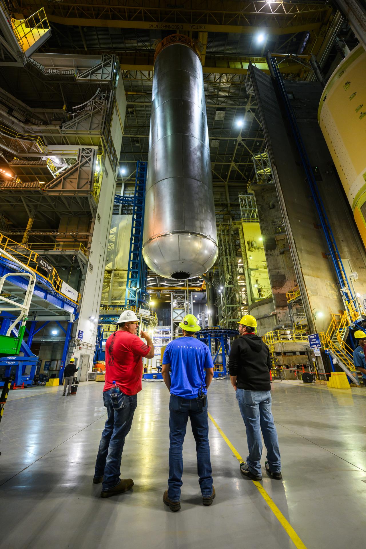  Teams at NASA’s Michoud Assembly Facility in New Orleans lift the 130-foot-tall liquid hydrogen tank off the vertical assembly center on Nov. 14. This is the fourth liquid hydrogen tank manufactured at the facility for the agency’s SLS (Space Launch System) rocket. The completed tank will be loaded into a production cell for technicians to remove the lift tool, perform dimensional scans, and then install brackets, which will allow the move crew to break the tank over from a vertical to a horizontal configuration.  