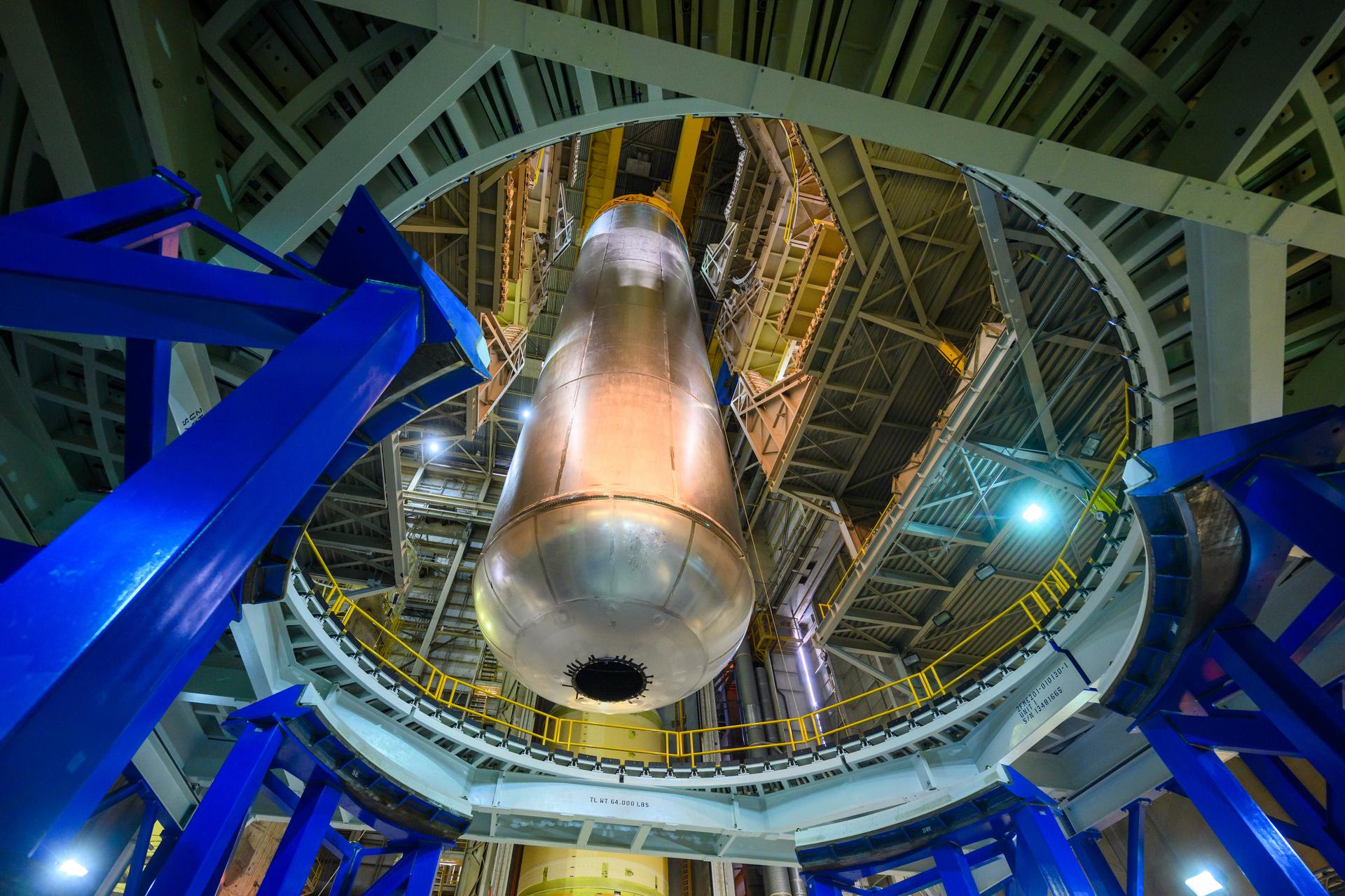  Teams at NASA’s Michoud Assembly Facility in New Orleans lift the 130-foot-tall liquid hydrogen tank off the vertical assembly center on Nov. 14. This is the fourth liquid hydrogen tank manufactured at the facility for the agency’s SLS (Space Launch System) rocket. The completed tank will be loaded into a production cell for technicians to remove the lift tool, perform dimensional scans, and then install brackets, which will allow the move crew to break the tank over from a vertical to a horizontal configuration.  