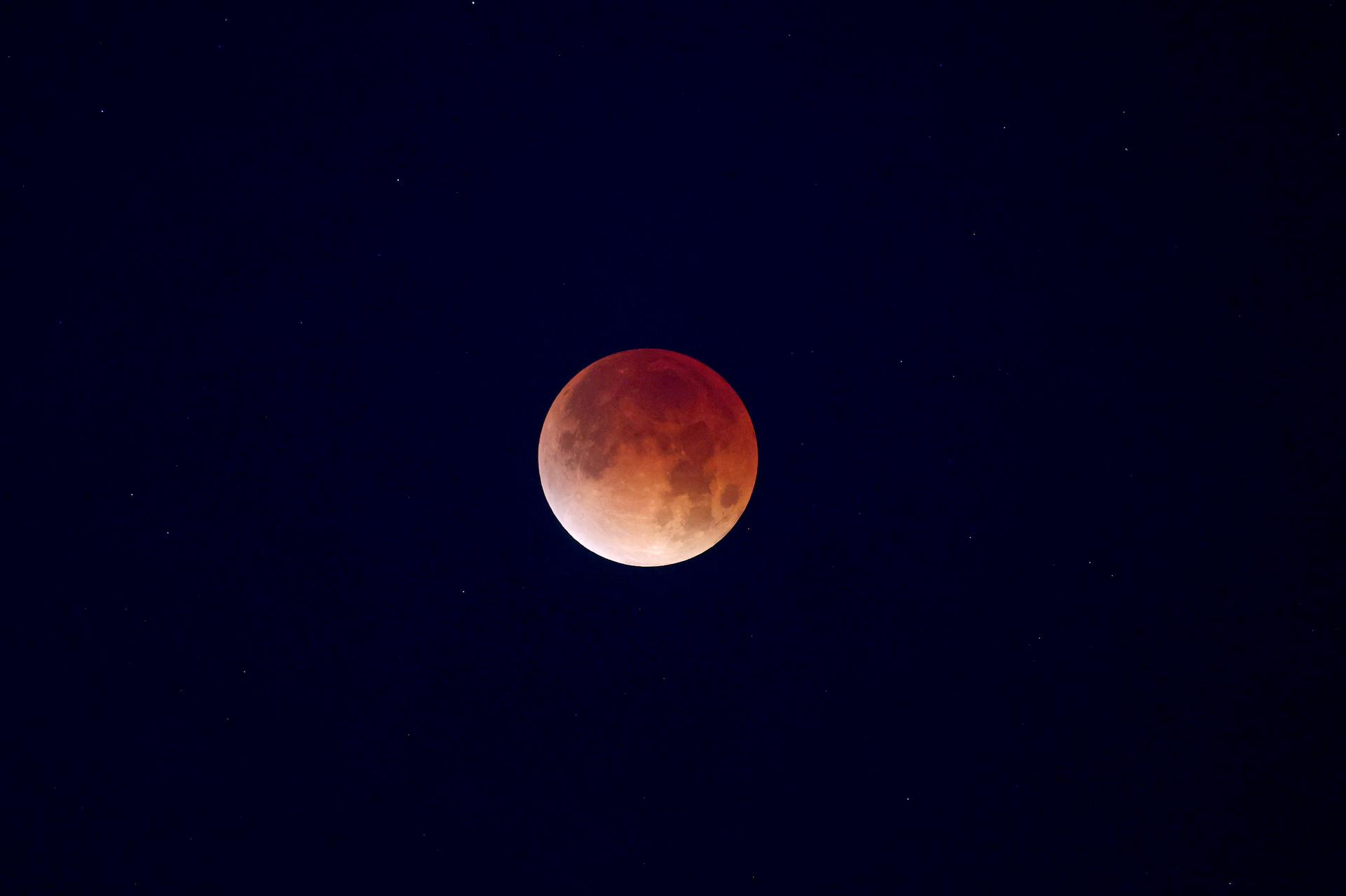 A total lunar eclipse rises over New Orleans, home of NASA’s Michoud Assembly Facility, in the early morning hours of Tuesday, March 3. A lunar eclipse occurs when Earth passes directly between the Sun and Moon, casting a huge shadow across the Moon’s surface. The Moon appears dark red or orange as the Sun’s light filters through Earth’s atmosphere.  Image credit: NASA/Michael DeMocker