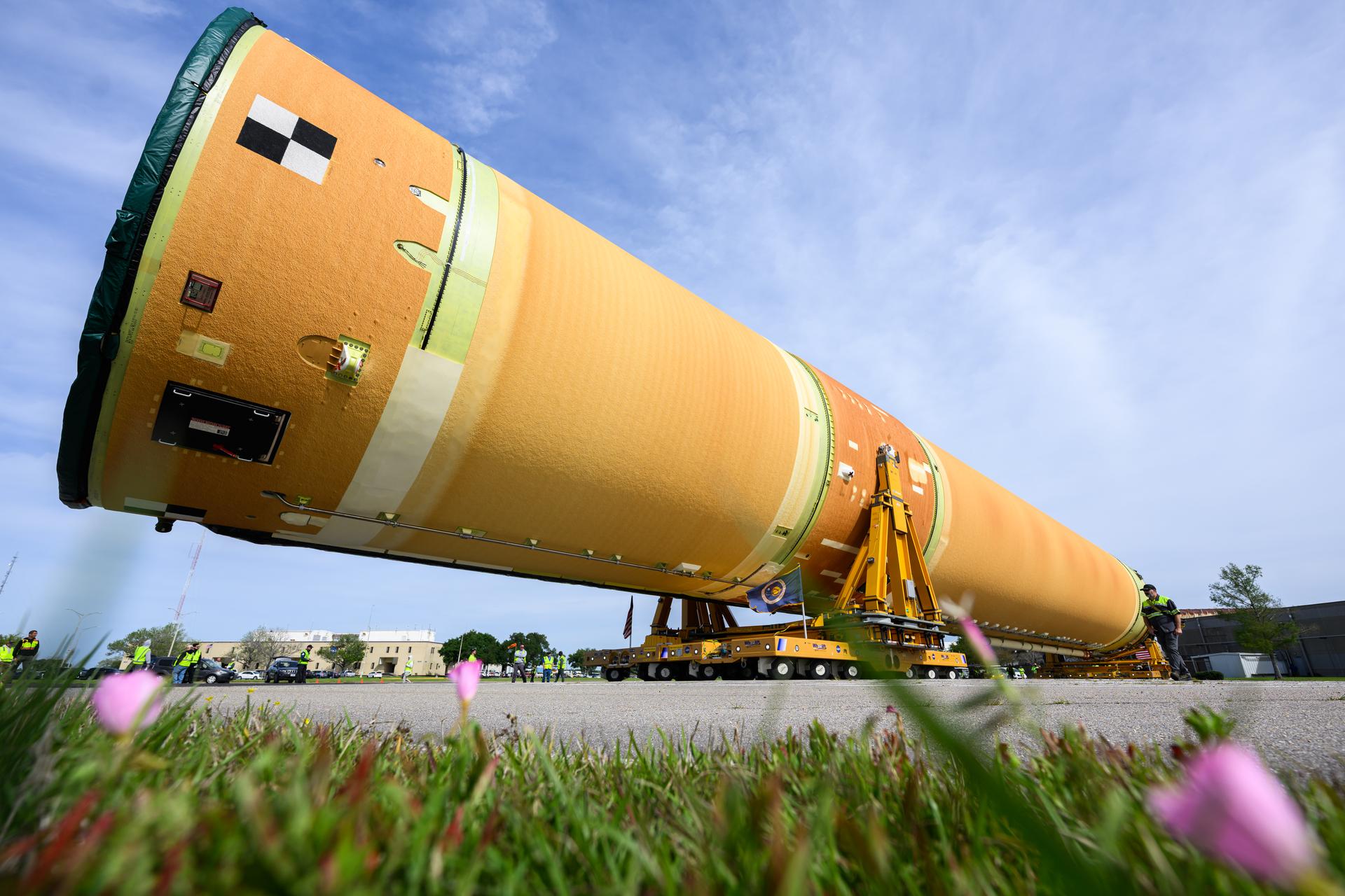 NASA moved the core stage, or the largest section, of the SLS (Space Launch System) rocket that will launch the crewed Artemis III mission in 2027 from the agency’s Michoud Assembly Facility to the agency’s Pegasus barge in New Orleans on April 20. The barge will ferry the top four-fifths – the section containing the liquid hydrogen tank, liquid oxygen tank, intertank, and forward skirt – of the SLS core stage to NASA’s Kennedy Space Center in Florida to complete outfitting and vertical integration.  Teams with NASA and Boeing, the SLS core stage lead contractor, used specialized transporters to guide the top four-fifths from the NASA rocket factory to Pegasus. Prior to the move, technicians added an engine section transportation simulator to the rocket stage for shipment to the Space Coast.  Next year’s Artemis III mission will launch astronauts to Earth’s orbit aboard the Orion spacecraft on top of SLS to test rendezvous and docking capabilities between Orion and commercial spacecraft needed to land Artemis IV astronauts on the Moon in 2028. NASA’s SLS is the only rocket capable of sending Orion, astronauts, and supplies to the Moon in a single launch.  Photo Credit: NASA/Eric Bordelon