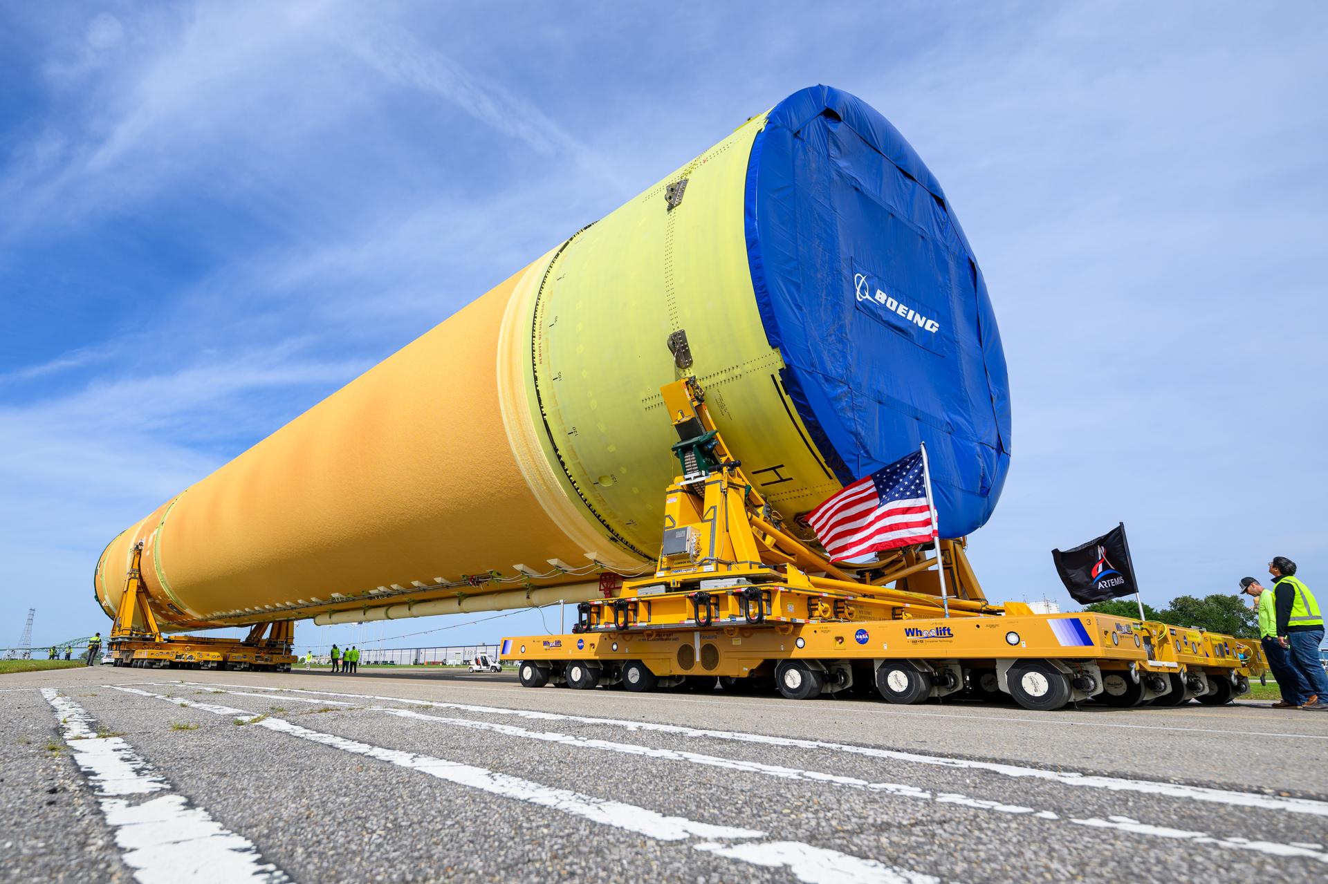 NASA moved the core stage, or the largest section, of the SLS (Space Launch System) rocket that will launch the crewed Artemis III mission in 2027 from the agency’s Michoud Assembly Facility to the agency’s Pegasus barge in New Orleans on April 20. The barge will ferry the top four-fifths – the section containing the liquid hydrogen tank, liquid oxygen tank, intertank, and forward skirt – of the SLS core stage to NASA’s Kennedy Space Center in Florida to complete outfitting and vertical integration.  Teams with NASA and Boeing, the SLS core stage lead contractor, used specialized transporters to guide the top four-fifths from the NASA rocket factory to Pegasus. Prior to the move, technicians added an engine section transportation simulator to the rocket stage for shipment to the Space Coast.  Next year’s Artemis III mission will launch astronauts to Earth’s orbit aboard the Orion spacecraft on top of SLS to test rendezvous and docking capabilities between Orion and commercial spacecraft needed to land Artemis IV astronauts on the Moon in 2028. NASA’s SLS is the only rocket capable of sending Orion, astronauts, and supplies to the Moon in a single launch.  Photo Credit: NASA/Eric Bordelon