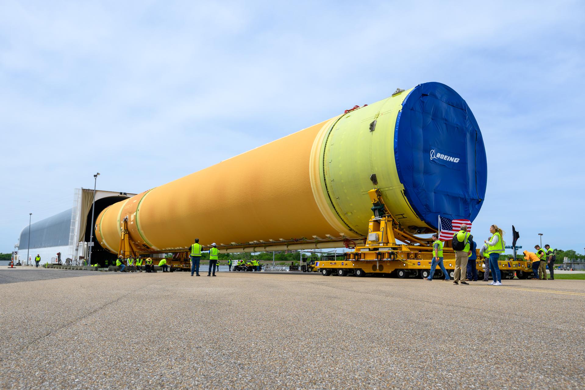 NASA moved the core stage, or the largest section, of the SLS (Space Launch System) rocket that will launch the crewed Artemis III mission in 2027 from the agency’s Michoud Assembly Facility to the agency’s Pegasus barge in New Orleans on April 20. The barge will ferry the top four-fifths – the section containing the liquid hydrogen tank, liquid oxygen tank, intertank, and forward skirt – of the SLS core stage to NASA’s Kennedy Space Center in Florida to complete outfitting and vertical integration.  Teams with NASA and Boeing, the SLS core stage lead contractor, used specialized transporters to guide the top four-fifths from the NASA rocket factory to Pegasus. Prior to the move, technicians added an engine section transportation simulator to the rocket stage for shipment to the Space Coast.  Next year’s Artemis III mission will launch astronauts to Earth’s orbit aboard the Orion spacecraft on top of SLS to test rendezvous and docking capabilities between Orion and commercial spacecraft needed to land Artemis IV astronauts on the Moon in 2028. NASA’s SLS is the only rocket capable of sending Orion, astronauts, and supplies to the Moon in a single launch.  Photo Credit: NASA/Eric Bordelon