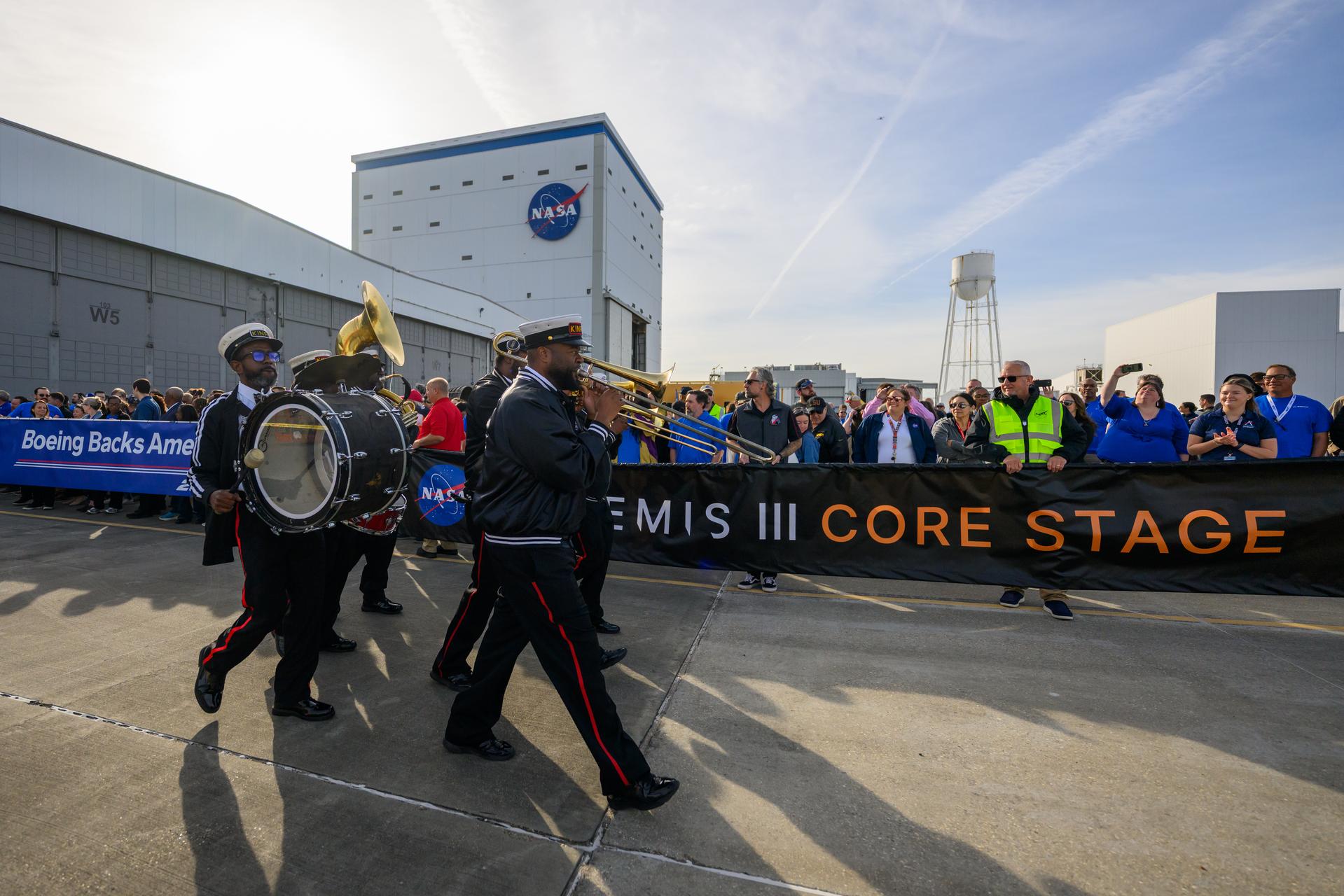 NASA moved the core stage, or the largest section, of the SLS (Space Launch System) rocket that will launch the crewed Artemis III mission in 2027 from the agency’s Michoud Assembly Facility to the agency’s Pegasus barge in New Orleans on April 20. The barge will ferry the top four-fifths – the section containing the liquid hydrogen tank, liquid oxygen tank, intertank, and forward skirt – of the SLS core stage to NASA’s Kennedy Space Center in Florida to complete outfitting and vertical integration.  Teams with NASA and Boeing, the SLS core stage lead contractor, used specialized transporters to guide the top four-fifths from the NASA rocket factory to Pegasus. Prior to the move, technicians added an engine section transportation simulator to the rocket stage for shipment to the Space Coast.  Next year’s Artemis III mission will launch astronauts to Earth’s orbit aboard the Orion spacecraft on top of SLS to test rendezvous and docking capabilities between Orion and commercial spacecraft needed to land Artemis IV astronauts on the Moon in 2028. NASA’s SLS is the only rocket capable of sending Orion, astronauts, and supplies to the Moon in a single launch. 