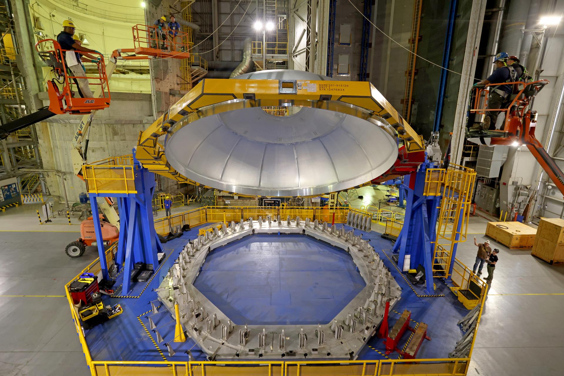 Teams at NASA’s Michoud Assembly Facility in New Orleans lift the aft dome for the liquid oxygen tank into the Vertical Assembly Center on May 11. The flight hardware will form part of the SLS (Space Launch System) rocket’s core stage for the Artemis IV mission. The aft dome is the final piece to complete the liquid oxygen tank structure. Inside the vertical assembly center – one of the largest friction-stir weld tools in the world – NASA and Boeing, SLS core stage prime contractor, will perform a circumferential weld to join the dome to the previously welded forward dome and two barrel structures to form the full liquid oxygen tank structure. The propellant tank is one of five major elements that make up the 212-foot-tall rocket stage. The core stage, along with its four RS-25 engines at its base, produces more than two million pounds of thrust to help launch NASA’s Orion spacecraft, astronauts, and supplies beyond Earth’s orbit and to the lunar surface for Artemis. Image credit: NASA/Michael DeMocker