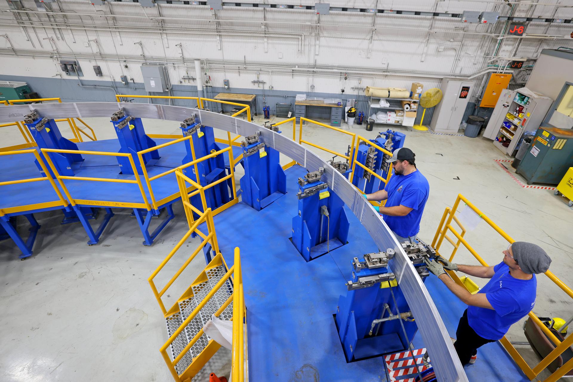 Teams at NASA’s Michoud Assembly Facility in New Orleans continue to make progress manufacturing core stages for the SLS (Space Launch System) rocket. In August, teams with NASA and Boeing, SLS core stage prime contractor, completed the first ring for the sixth SLS core stage. The core stage rings are welded together through a friction-stir welding process. A completed ring is 27.6 feet in diameter and serves as a connection point to join the large core stage structures together. The rings also provide structural stability to the bottoms of the domes. The 212-foot-tall SLS rocket core stage is made up of 10 major barrel sections, four dome sections, and seven rings. The components come together to form the five major sections of the core stage – the engine section, liquid hydrogen tank, intertank, liquid oxygen tank, and forward skirt.