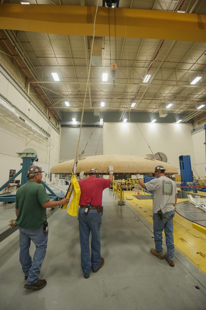 THE ORION HEAT SHIELD, WHICH WAS AT NASA’S MARSHALL SPACE FLIGHT CENTER FROM MARCH-MAY 2015 FOR ENGINEERING AND ANALYSIS, IS READIED FOR DEPARTURE AT THE END OF ITS STAY. THE HEAT SHIELD’S ABLATED SURFACE MATERIAL WAS REMOVED AT MARSHALL FOR ANALYSIS, USING THE CENTER’S STATE-OF-THE-ART SEVEN-AXIS MILLING MACHINE. IT NEXT WILL GO TO NASA’S LANGLEY RESEARCH CENTER FOR WATER-IMPACT TESTING. NASA’S JOHNSON SPACE CENTER LEADS THE ORION PROGRAM FOR NASA.