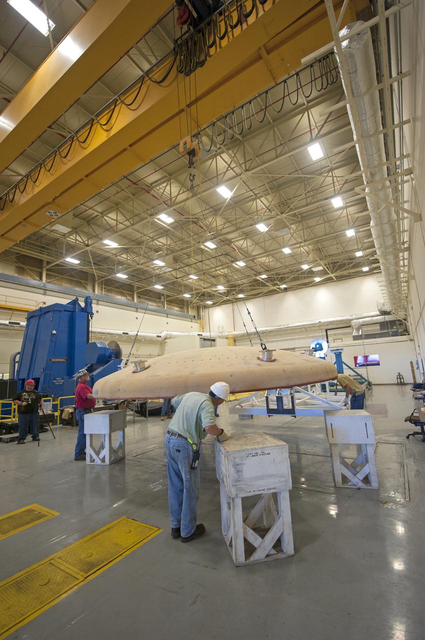 THE ORION HEAT SHIELD, WHICH WAS AT NASA’S MARSHALL SPACE FLIGHT CENTER FROM MARCH-MAY 2015 FOR ENGINEERING AND ANALYSIS, IS READIED FOR DEPARTURE AT THE END OF ITS STAY. THE HEAT SHIELD’S ABLATED SURFACE MATERIAL WAS REMOVED AT MARSHALL FOR ANALYSIS, USING THE CENTER’S STATE-OF-THE-ART SEVEN-AXIS MILLING MACHINE. IT NEXT WILL GO TO NASA’S LANGLEY RESEARCH CENTER FOR WATER-IMPACT TESTING. NASA’S JOHNSON SPACE CENTER LEADS THE ORION PROGRAM FOR NASA.