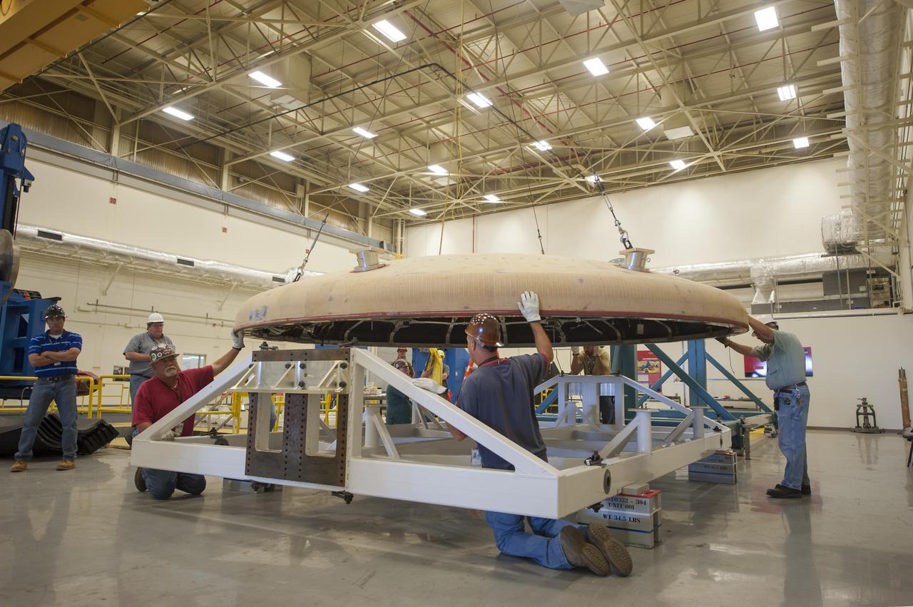 THE ORION HEAT SHIELD, WHICH WAS AT NASA’S MARSHALL SPACE FLIGHT CENTER FROM MARCH-MAY 2015 FOR ENGINEERING AND ANALYSIS, IS READIED FOR DEPARTURE AT THE END OF ITS STAY. THE HEAT SHIELD’S ABLATED SURFACE MATERIAL WAS REMOVED AT MARSHALL FOR ANALYSIS, USING THE CENTER’S STATE-OF-THE-ART SEVEN-AXIS MILLING MACHINE. IT NEXT WILL GO TO NASA’S LANGLEY RESEARCH CENTER FOR WATER-IMPACT TESTING. NASA’S JOHNSON SPACE CENTER LEADS THE ORION PROGRAM FOR NASA.