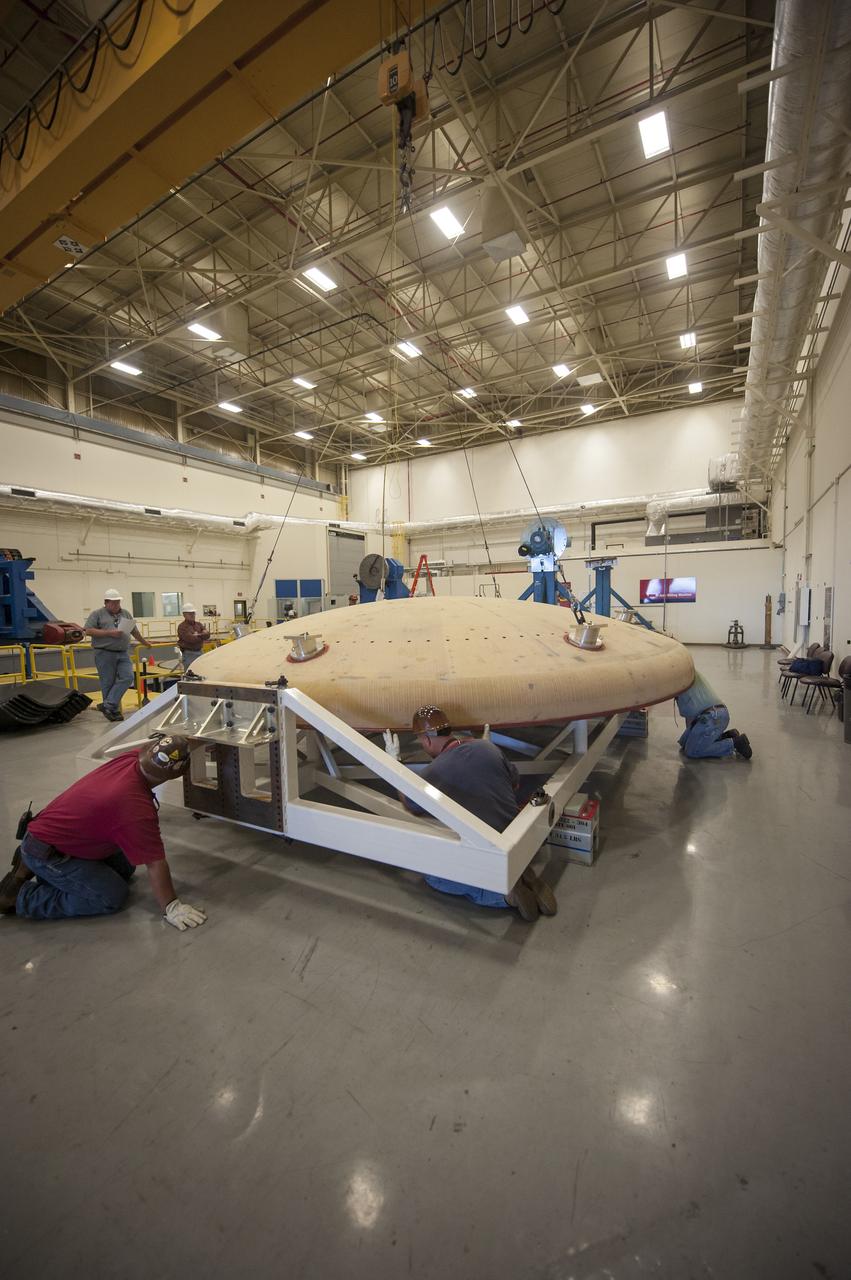 THE ORION HEAT SHIELD, WHICH WAS AT NASA’S MARSHALL SPACE FLIGHT CENTER FROM MARCH-MAY 2015 FOR ENGINEERING AND ANALYSIS, IS READIED FOR DEPARTURE AT THE END OF ITS STAY. THE HEAT SHIELD’S ABLATED SURFACE MATERIAL WAS REMOVED AT MARSHALL FOR ANALYSIS, USING THE CENTER’S STATE-OF-THE-ART SEVEN-AXIS MILLING MACHINE. IT NEXT WILL GO TO NASA’S LANGLEY RESEARCH CENTER FOR WATER-IMPACT TESTING. NASA’S JOHNSON SPACE CENTER LEADS THE ORION PROGRAM FOR NASA.