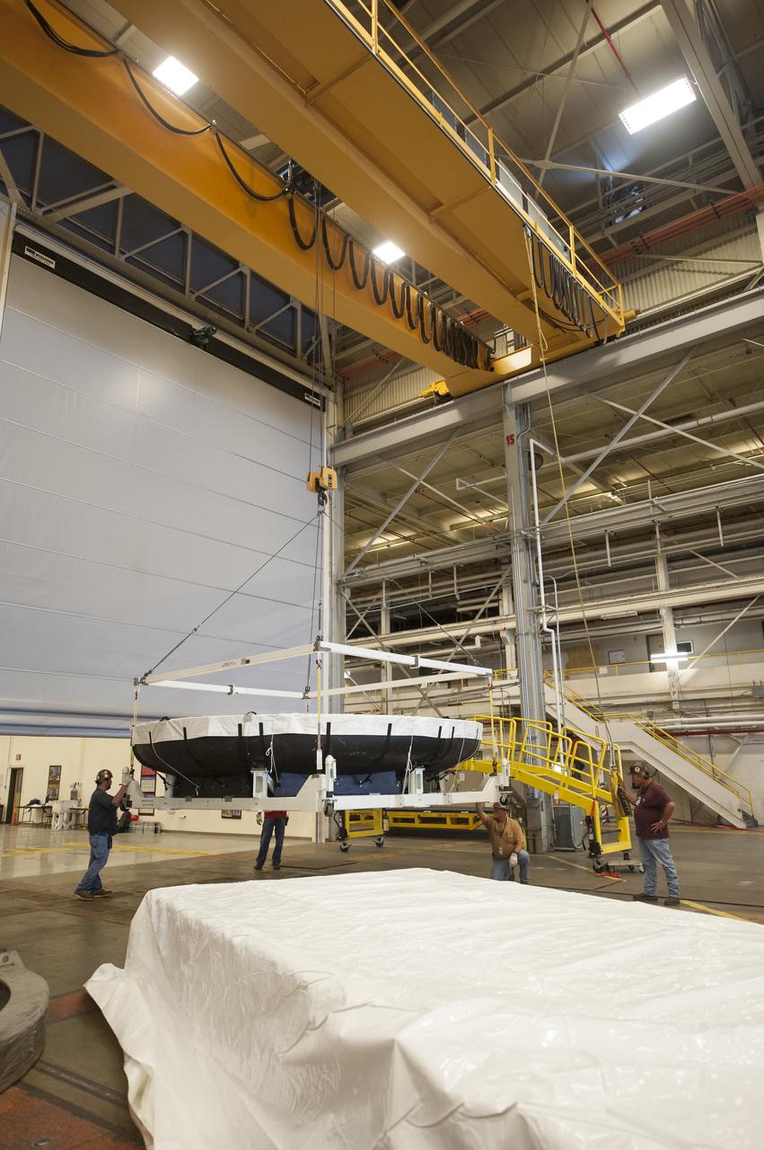 THE ORION HEAT SHIELD, WHICH WAS AT NASA’S MARSHALL SPACE FLIGHT CENTER FROM MARCH-MAY 2015 FOR ENGINEERING AND ANALYSIS, IS READIED FOR DEPARTURE AT THE END OF ITS STAY. THE HEAT SHIELD’S ABLATED SURFACE MATERIAL WAS REMOVED AT MARSHALL FOR ANALYSIS, USING THE CENTER’S STATE-OF-THE-ART SEVEN-AXIS MILLING MACHINE. IT NEXT WILL GO TO NASA’S LANGLEY RESEARCH CENTER FOR WATER-IMPACT TESTING. NASA’S JOHNSON SPACE CENTER LEADS THE ORION PROGRAM FOR NASA.