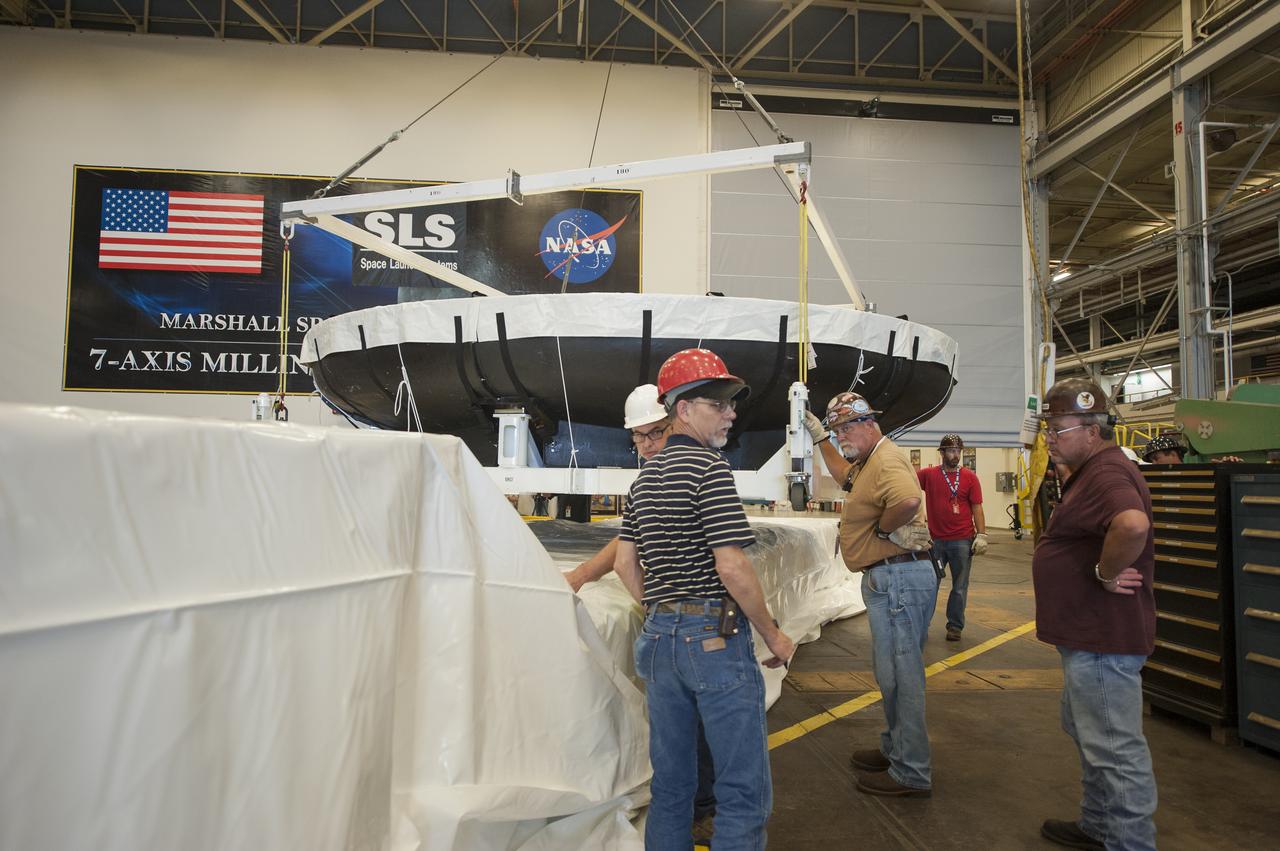 THE ORION HEAT SHIELD, WHICH WAS AT NASA’S MARSHALL SPACE FLIGHT CENTER FROM MARCH-MAY 2015 FOR ENGINEERING AND ANALYSIS, IS READIED FOR DEPARTURE AT THE END OF ITS STAY. THE HEAT SHIELD’S ABLATED SURFACE MATERIAL WAS REMOVED AT MARSHALL FOR ANALYSIS, USING THE CENTER’S STATE-OF-THE-ART SEVEN-AXIS MILLING MACHINE. IT NEXT WILL GO TO NASA’S LANGLEY RESEARCH CENTER FOR WATER-IMPACT TESTING. NASA’S JOHNSON SPACE CENTER LEADS THE ORION PROGRAM FOR NASA.