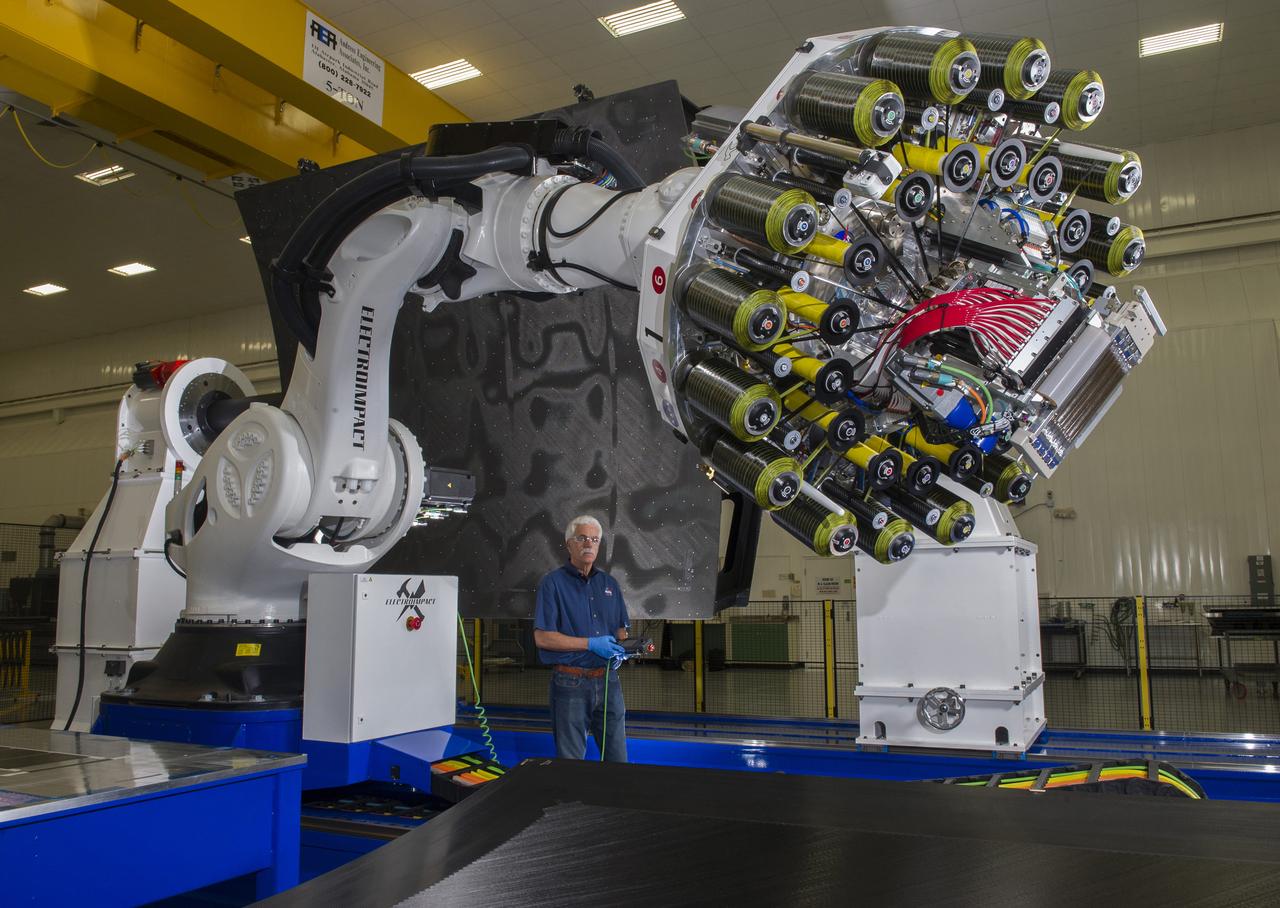 MATERIALS ENGINEER LARRY PELHAM OF NASA’S MARSHALL SPACE FLIGHT CENTER IN HUNTSVILLE, ALABAMA, OPERATES THE CEUS AUTOMATED FIBER PLACEMENT CYLINDRICAL MANUFACTURING TOOL IN BUILDING 4707. THE TOOL WILL BE USED BY THE COMPOSITES FOR EXPLORATION UPPER STAGE PROJECT AT MARSHALL, WHICH IS ANALYZING COMPOSITE MATERIALS TO SUPPORT FUTURE HARDWARE FOR NASA’S SPACE LAUNCH SYSTEM AND OTHER NEXT-GENERATION SPACECRAFT…