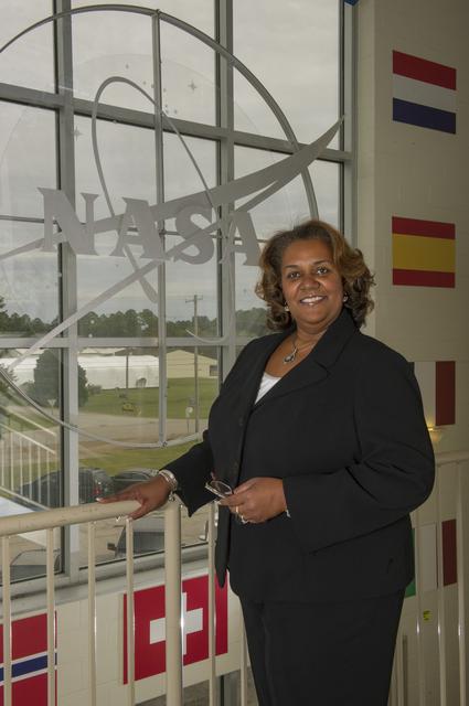 NASA image: Lybrease Woodard in the lobby of the Payload Operations Integration Center facility.