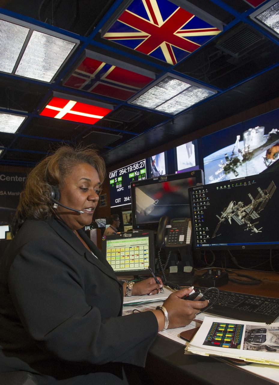 LYBREASE WOODARD ON CONSOLE AT PAYLOAD OPERATIONS CONTROL CENTER FOR FORBES MAGAZINE ARTICLE