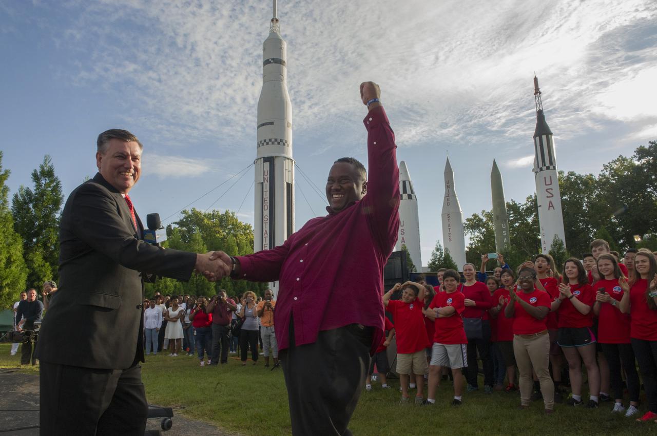 TRENT GRIFFIN, RIGHT, IS CONGRATULATED FOR HIS WORK IN THE COMMUNITY AND HIS OUTREACH EFFORTS TO ENCOURAGE STUDENTS TO ENTER THE SCIENCE, TECHNOLOGY, ENGINEERING AND MATH FIELDS BY MARSHALL CENTER DIRECTOR PATRICK SCHEUERMANN. GRIFFIN WAS FEATURED AS A HOMETOWN HERO ON ABC’S "GOOD MORNING AMERICA" AT THE U.S. SPACE & ROCKET CENTER.