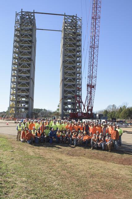 NASA image: Butch Wilmore group photo with construction workers