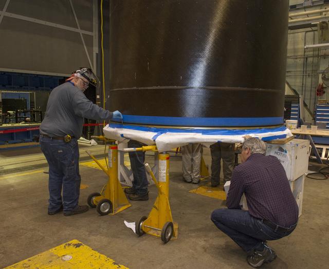 NASA image: CHECKING DEPTH OF EPOXY