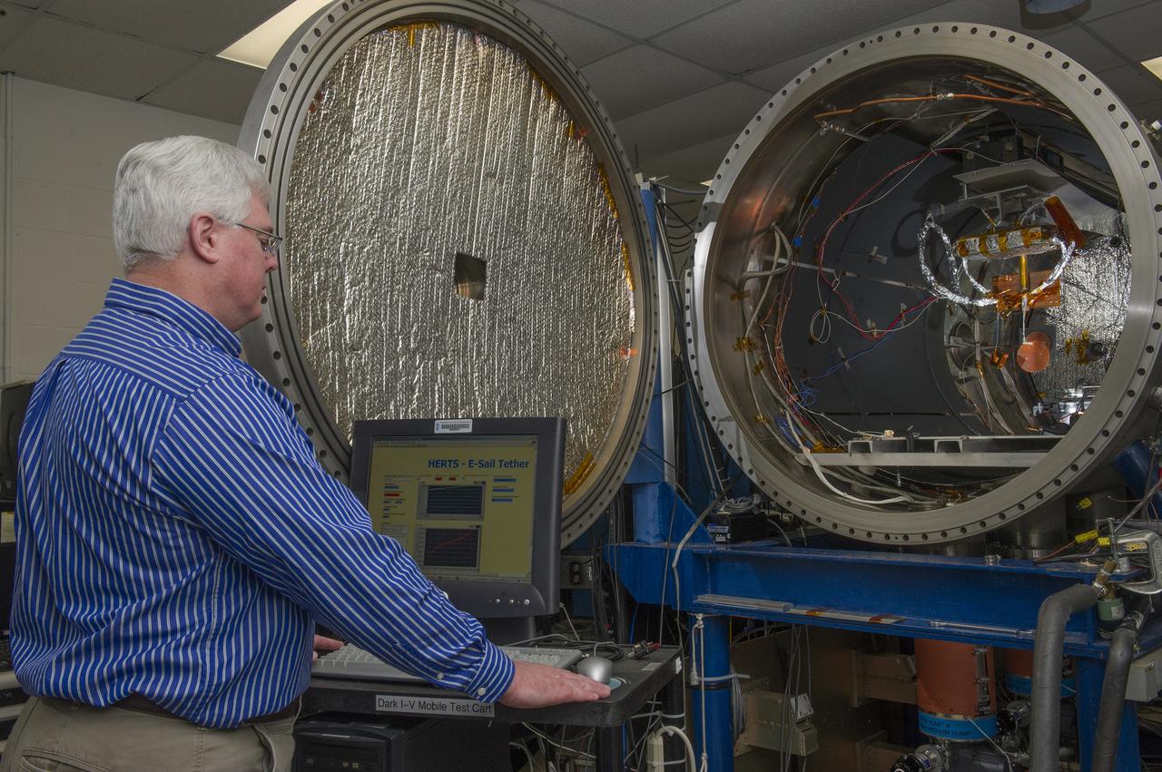 TODD SCHNEIDER PREPARES A PLASMA CHAMBER IN BUILDING 4605 AT MSFC FOR AN UPCOMING TEST. SCHNEIDER IS A PHYSICIST IN THE MATERIALS AND PROCESSES DEPARTMENT AT MSFC.