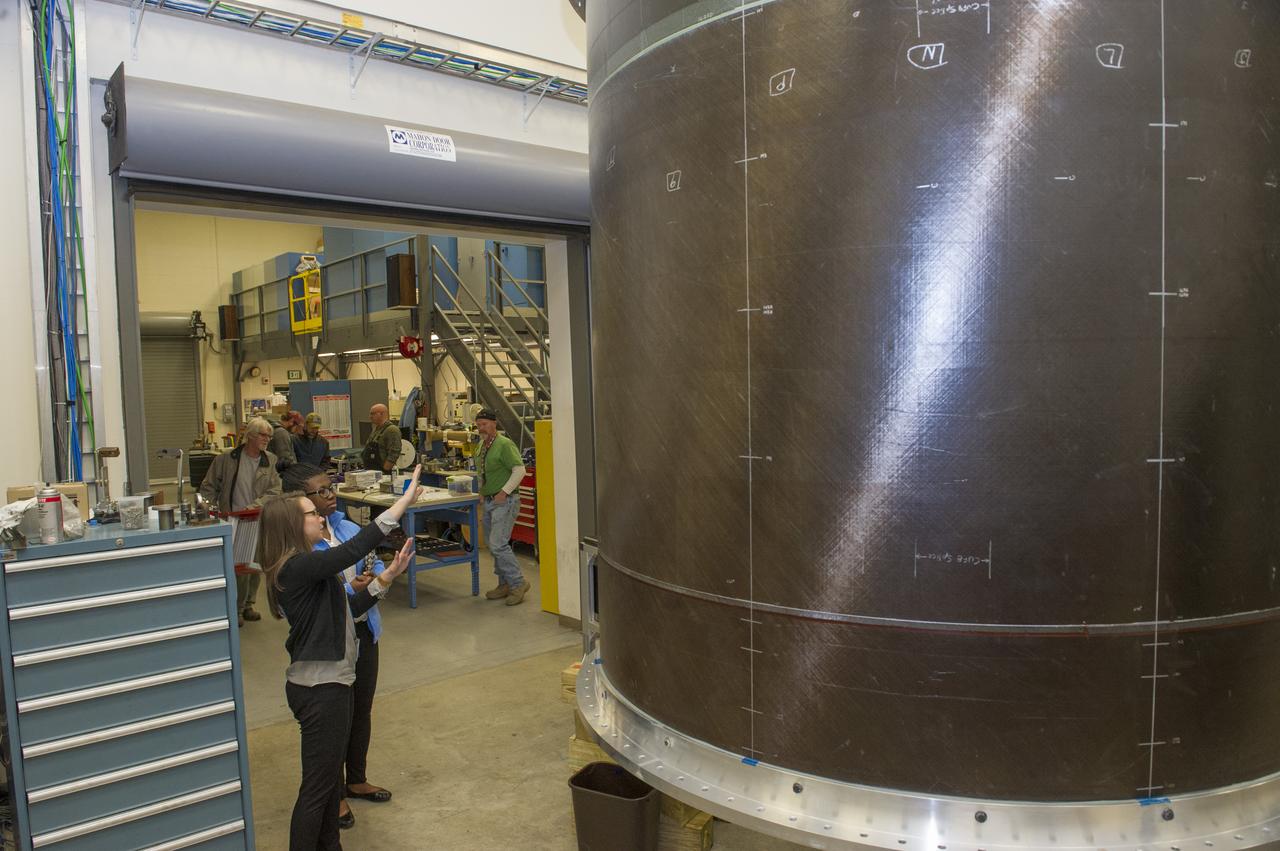 MICHELLE TILLOTSON, AN ENGINEER AT NASA’S MARSHALL SPACE FLIGHT CENTER, SHOWS KALYN HOPKINS A STUDENT AT THE MIAMI VALLEY SCHOOL, DAYTON OHIO, NEW EQUIPMENT THAT WILL BE USED TO TEST THE PROPELLANT TANKS FOR THE SLS