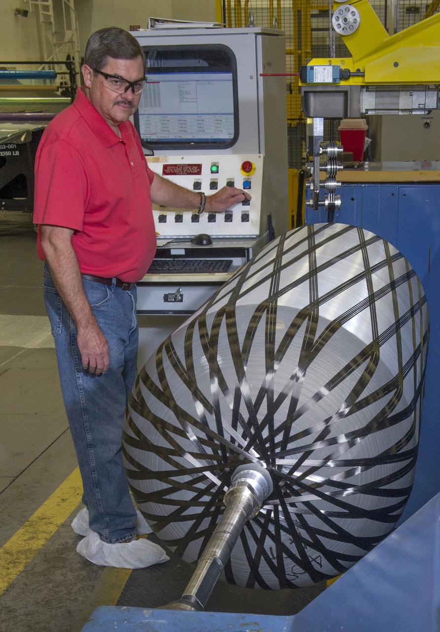 PHILLIP THOMPSON WRAPS PRESSURE VESSEL WITH COMPOSITE MATERIAL 