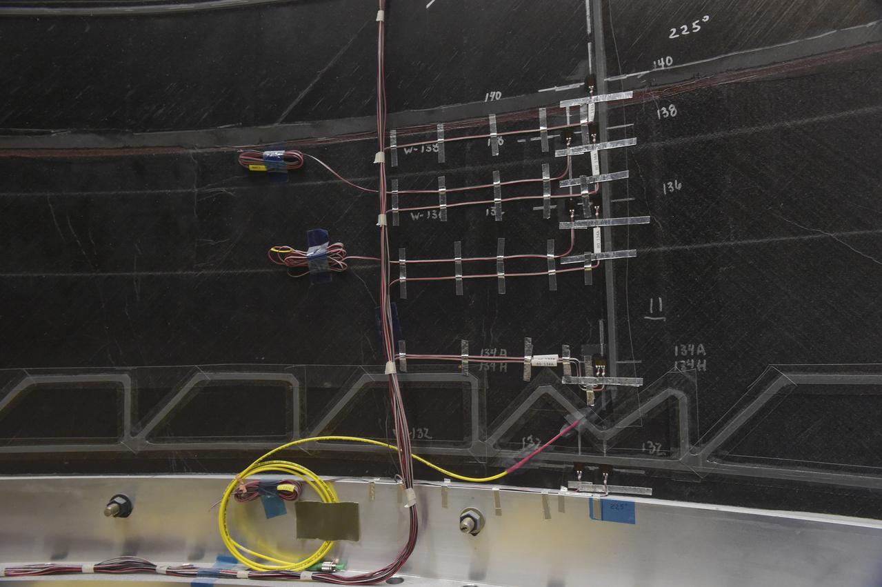 INSTALLATION OF STRESS SENSORS TO SHELL BUCKLE KNOCKDOWN FACTOR COMPOSITE TANK.