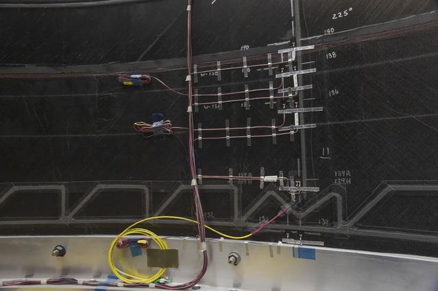 NASA image: INSTALLATION OF STRESS SENSORS TO SBKF COMPOSITE TANK