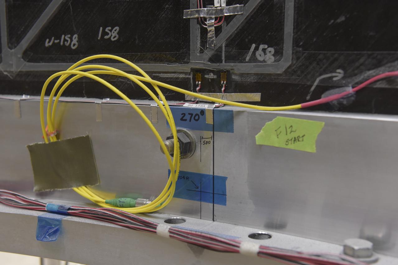 INSTALLATION OF STRESS SENSORS TO SHELL BUCKLE KNOCKDOWN FACTOR COMPOSITE TANK.