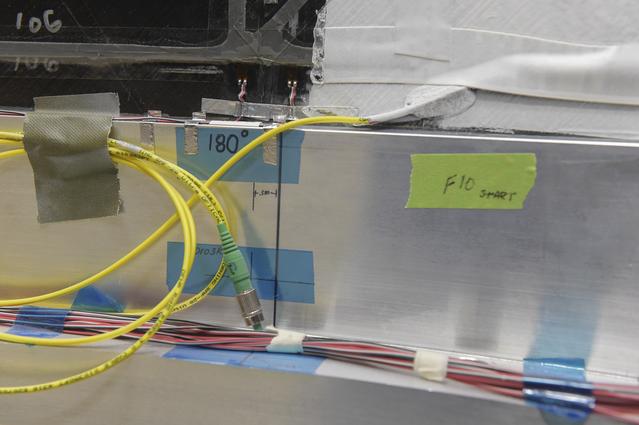 NASA image: INSTALLATION OF STRESS SENSORS TO SBKF COMPOSITE TANK