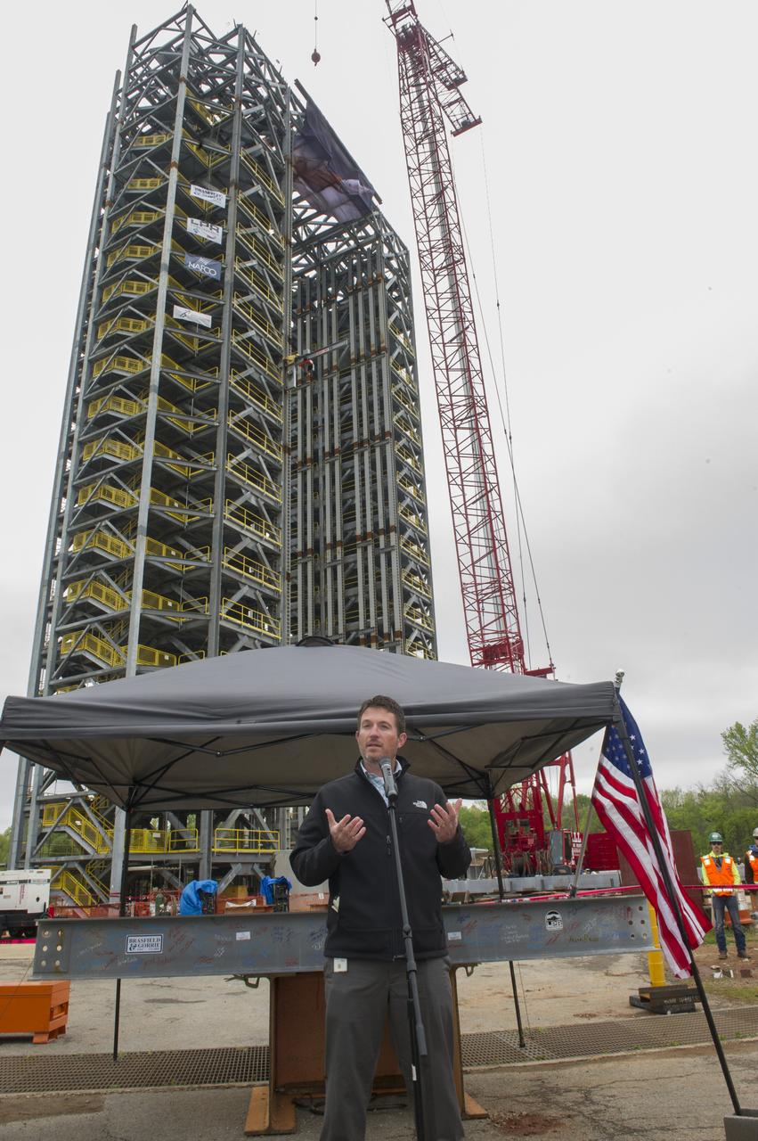 PHIL HENDRIX, SPEAKS TO THE CROWD IN FRONT OF A STEEL BEAM DESTINED FOR TEST STAND 4693 DURING THE STRUCTURE'S TOPPING OUT CEREMONY APRIL 12.