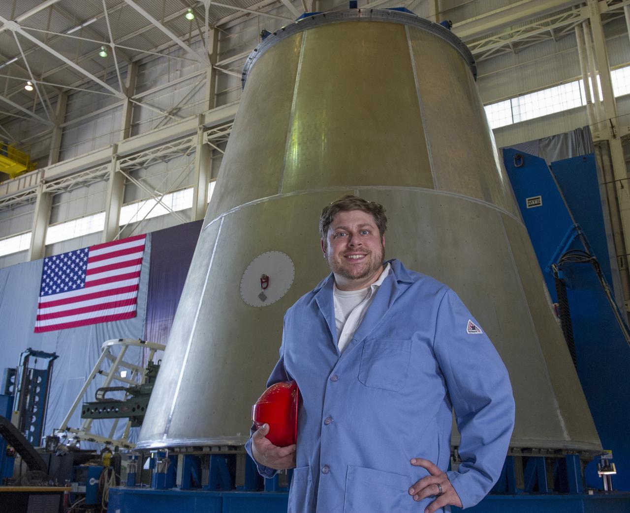 MARSHALL WELD ENGINEER JUSTIN LITTELL POSES WITH LAUNCH VEHICLE STAGE ADAPTER