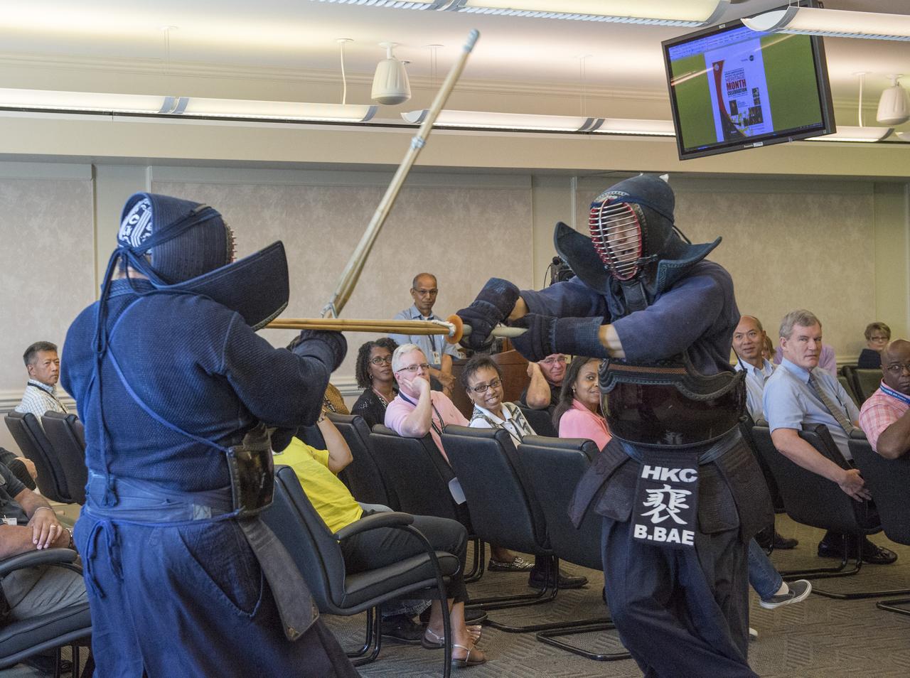 BRIAN BAE, EV41, AND JOHN EARL BROWN, U.S. ARMY,  CONDUCT KENDO DEMONSTRATION AT ASIAN AMERICANS AND PACIFIC ISLANDERS MONTH CELEBRATION EVENT MAY 31.