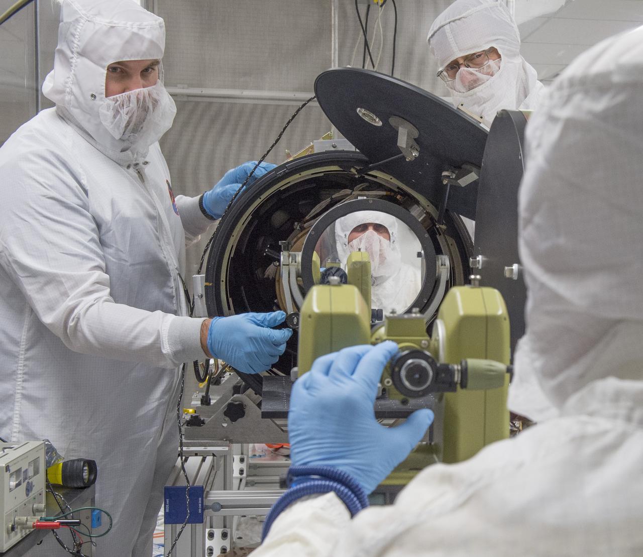 PATRICK CHAMPEY, (LEFT), DICK GATES, (RIGHT), AND BILL PODGORSKI, (SEATED), ALIGN SUN SENSOR TO HI-C TELESCOPE USING THEODOLITE