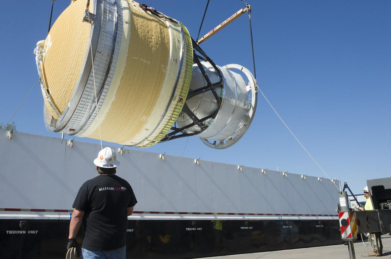 TWO CRANES LIFT THE APPROXIMATELY 8,000-POUND INTERIM CRYOGENIC PROPULSION STAGE TEST ARTICLE OUT OF ITS CRATE AT MARSHALL. THE TEST ARTICLE ARRIVED AT MARSHALL SPACE FLIGHT CENTER VIA BARGE ON THE TENNESSEE RIVER AND WAS TRANSPORTED TO BUILDING 4649 WHERE TESTING WILL BEGIN.