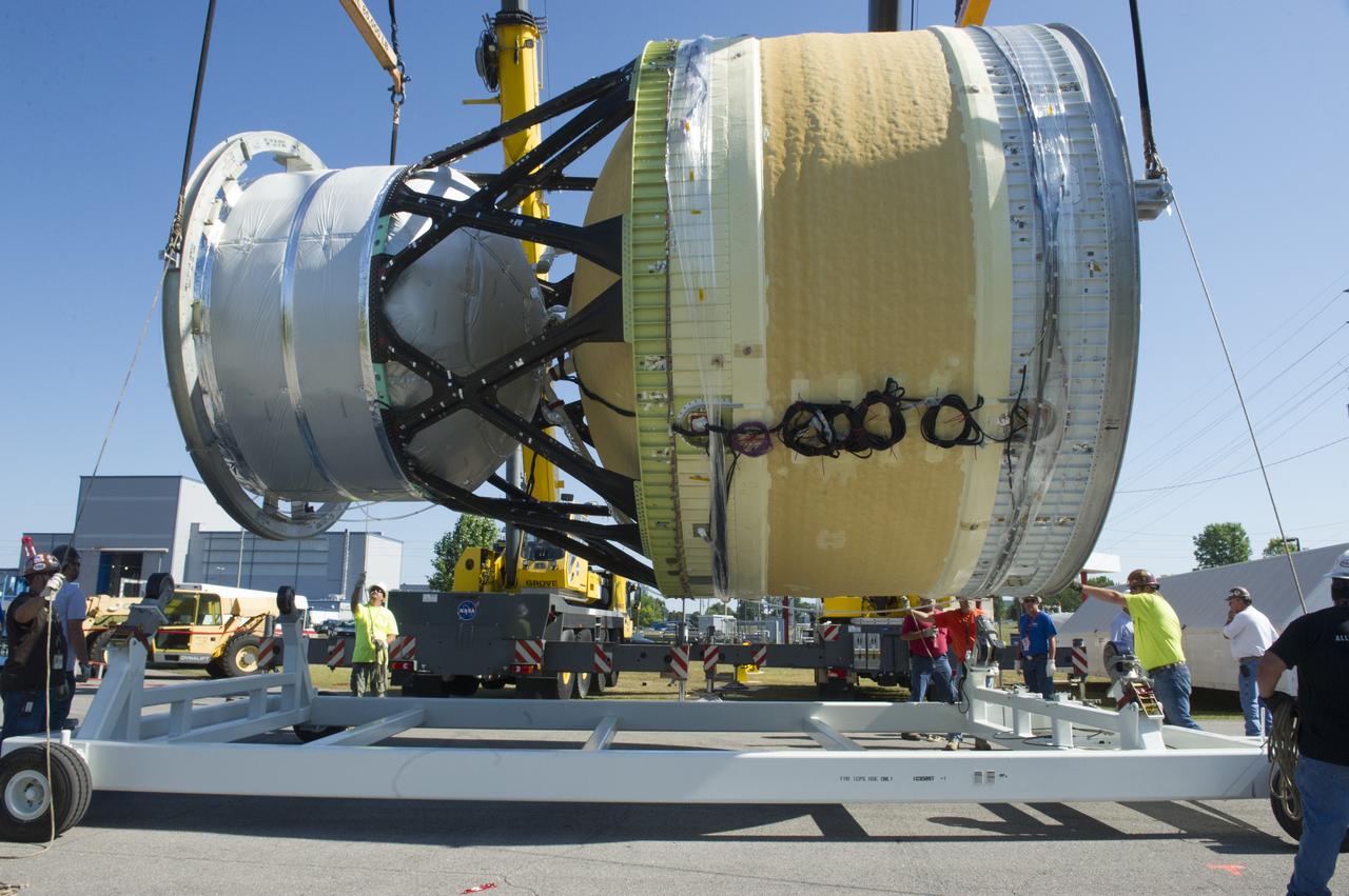 TWO CRANES LIFT THE APPROXIMATELY 8,000-POUND INTERIM CRYOGENIC PROPULSION STAGE TEST ARTICLE OUT OF ITS CRATE AT MARSHALL. THE TEST ARTICLE ARRIVED AT MARSHALL SPACE FLIGHT CENTER VIA BARGE ON THE TENNESSEE RIVER AND WAS TRANSPORTED TO BUILDING 4649 WHERE TESTING WILL BEGIN.