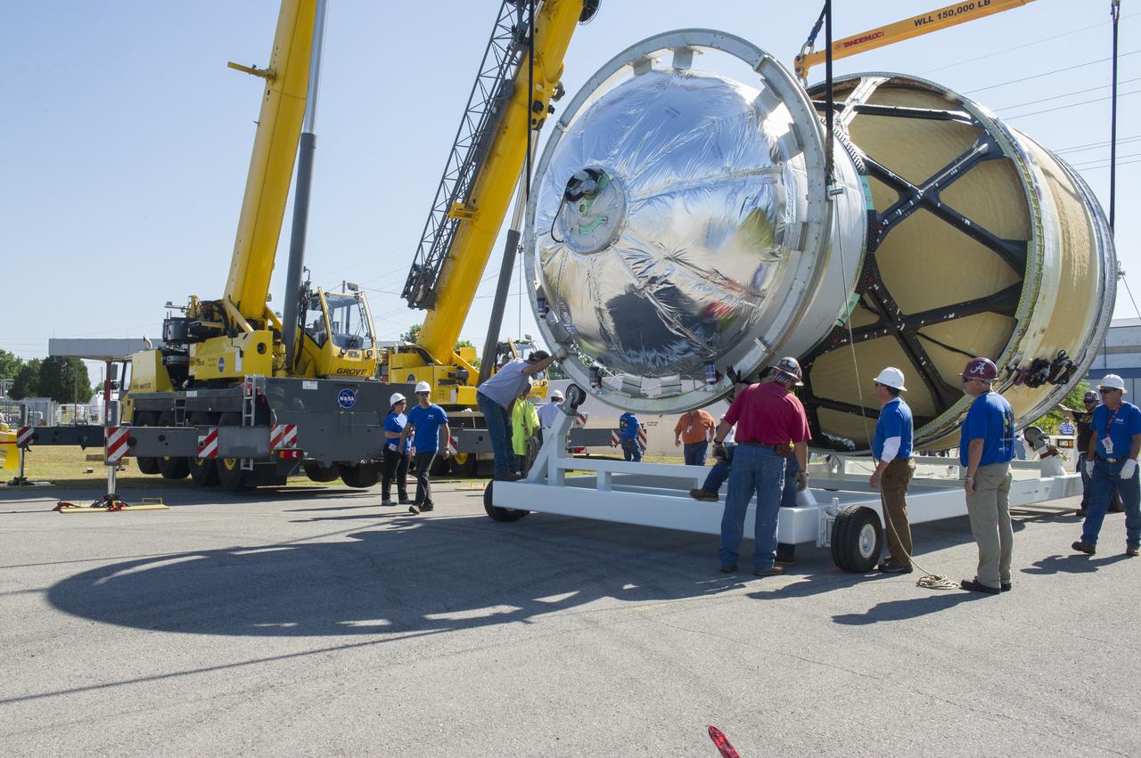 TWO CRANES LIFT THE APPROXIMATELY 8,000-POUND INTERIM CRYOGENIC PROPULSION STAGE TEST ARTICLE OUT OF ITS CRATE AT MARSHALL. THE TEST ARTICLE ARRIVED AT MARSHALL SPACE FLIGHT CENTER VIA BARGE ON THE TENNESSEE RIVER AND WAS TRANSPORTED TO BUILDING 4649 WHERE TESTING WILL BEGIN.