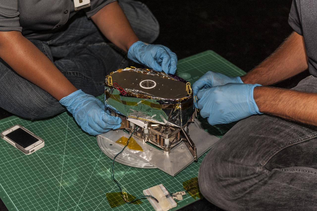 NEAR EARTH ASTEROID (NEA) SAIL TEAM PERFORMING A DEPLOYMENT OF THE FLIGHT-LIKE ENGINEERING DEVELOPMENT UNIT SOLAR SAIL. THE SAIL WAS MANUFACTURED AT NEXOLVE (HSV, AL) AND DEPLOYED FOR THE FIRST TIME AT MSFC ON AUGUST 4TH, 2016