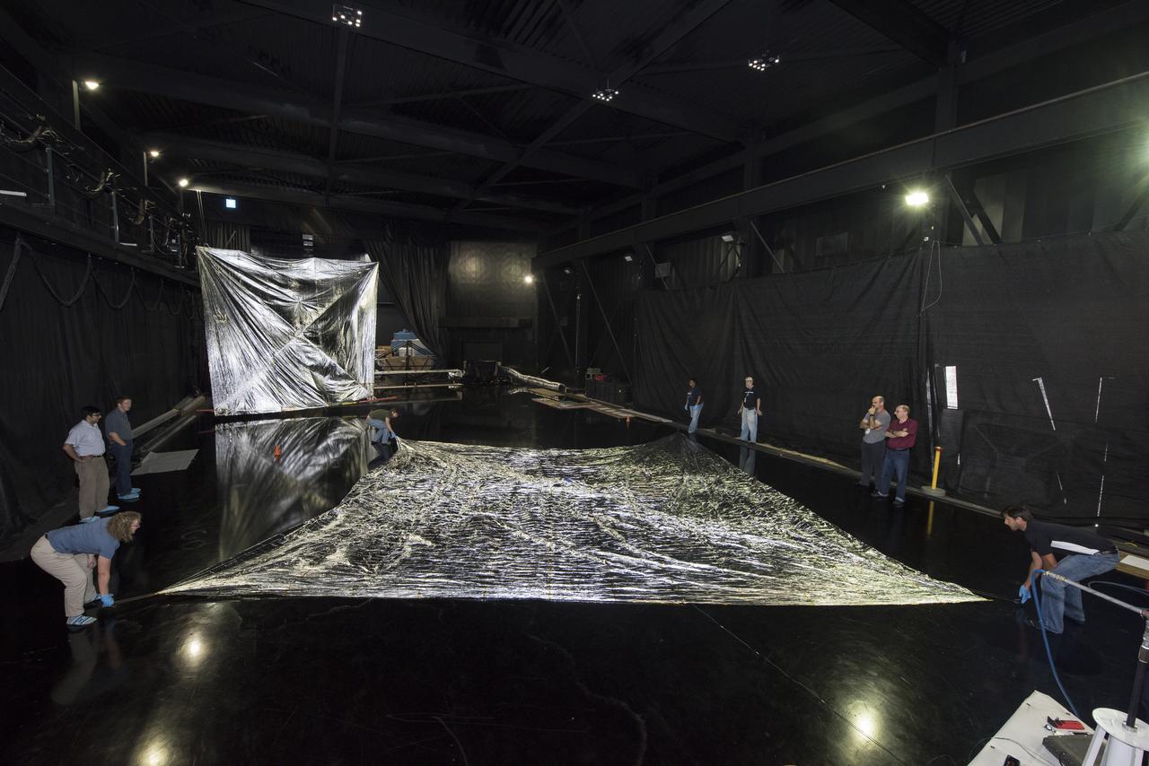 NEAR EARTH ASTEROID (NEA) SAIL TEAM PERFORMING A DEPLOYMENT OF THE FLIGHT-LIKE ENGINEERING DEVELOPMENT UNIT SOLAR SAIL. THE SAIL WAS MANUFACTURED AT NEXOLVE (HSV, AL) AND DEPLOYED FOR THE FIRST TIME AT MSFC ON AUGUST 4TH, 2016