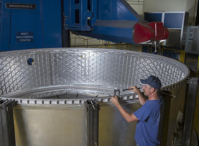 NASA image: DAVID OSBORNE CHECKS PRECISION MACHINING OF MSA FLIGHT HARDWARE