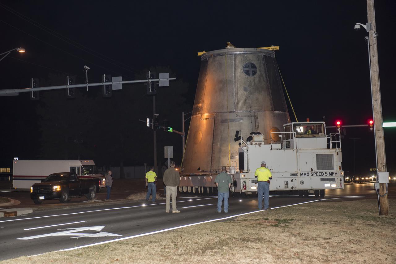 A SLS LAUNCH VEHICLE STAGE ADAPTER IS MOVED FROM THE VERTICAL WELD TOOL STATION IN MSFC’S BUILDING 4755 TO THE WEST TEST AREA’S TEST STAND 4699 WHERE IT WILL UNDERGO FURTHER TESTING OF ITS ABILITY TO WITHSTAND THE STRESSES RELATED TO LAUNCH AND SPACE TRAVEL.